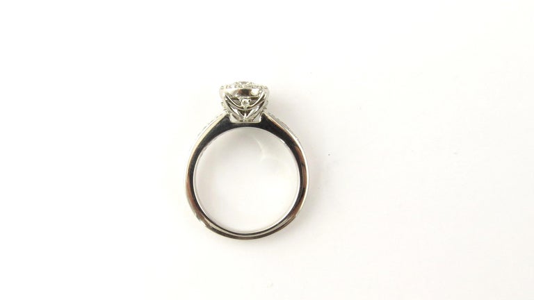 Platinum Halo Round Brilliant Diamond Engagement Ring .65 Carat at 1stDibs