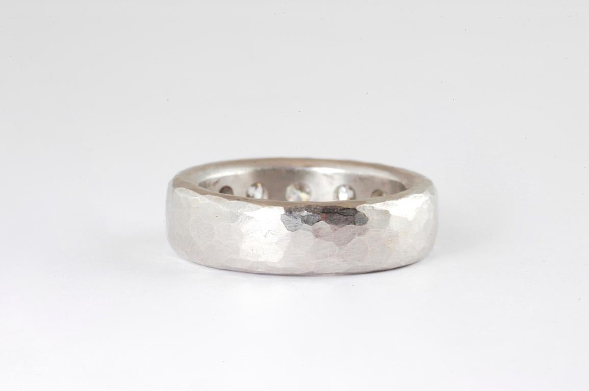 5.5mm platinum hammered ring with brilliant cut diamonds 1.21cts total approximate weight handmade in Notting Hill London by renowned British jewellery designer Malcolm Betts.  Heavy hammered Platinum gypsy set with high quality brilliant cut