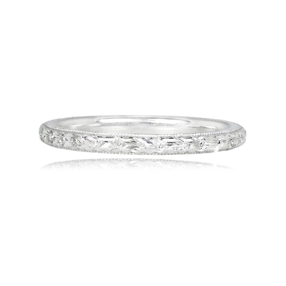 A meticulously handcrafted wedding band draws inspiration from the Art Deco era, boasting intricate hand engravings. Crafted from platinum, the band is adorned with fine milgrain detailing, creating a timeless and elegant piece.

Band Width: The