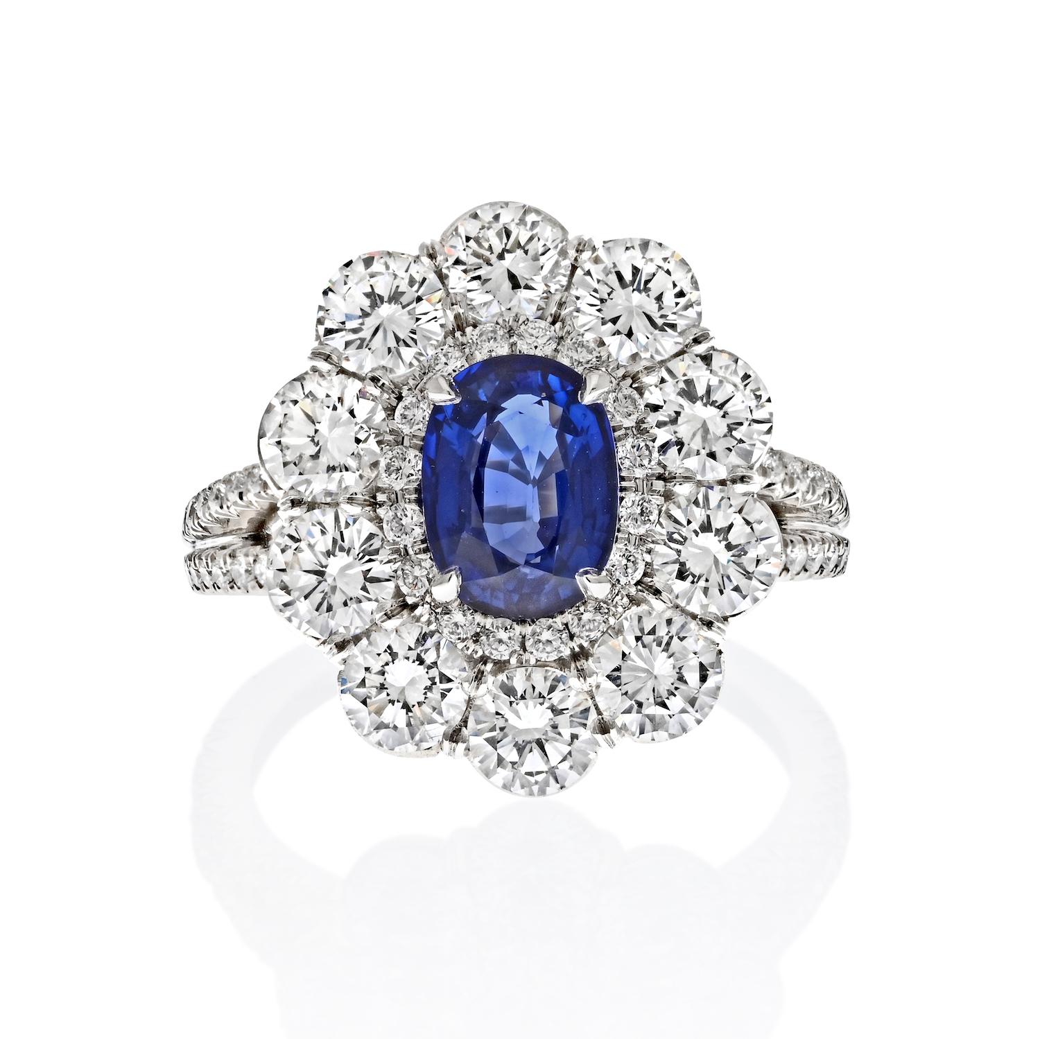 Elegance Meets Refinement: The Oval Cut Blue Sapphire and Diamond Halo Ring

Discover the epitome of grace and sophistication with this exquisite oval-cut blue sapphire and diamond halo ring, a creation inspired by timeless elegance.

**A Gem of