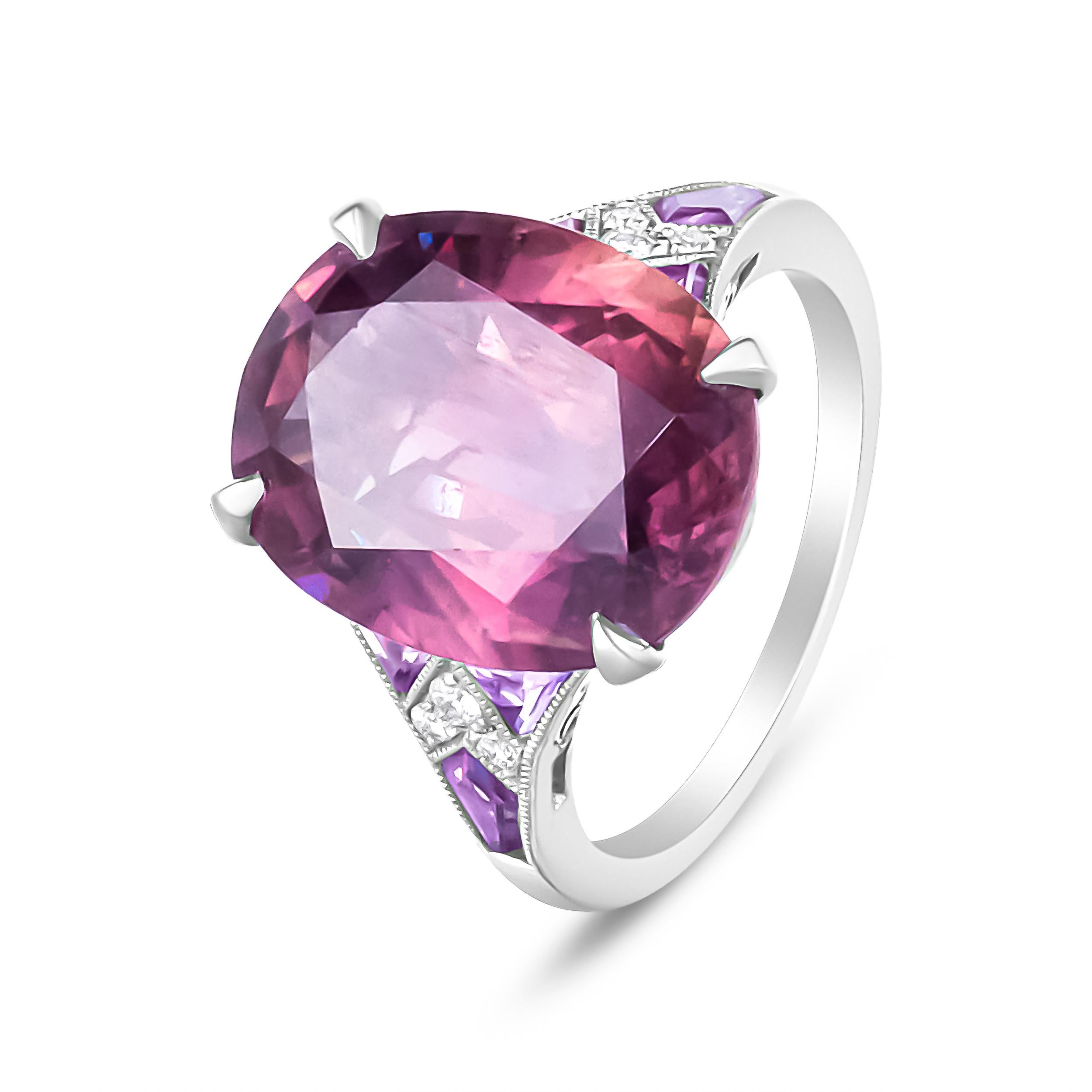 This dynamic cocktail ring featuring the blazing brilliance of a 10 1/2 carat cushion cut purple sapphire in a 4-prong setting, with stunning facets to glorify its sparkling nature. Accent diamonds uplift the glamour of this ring at an approximate