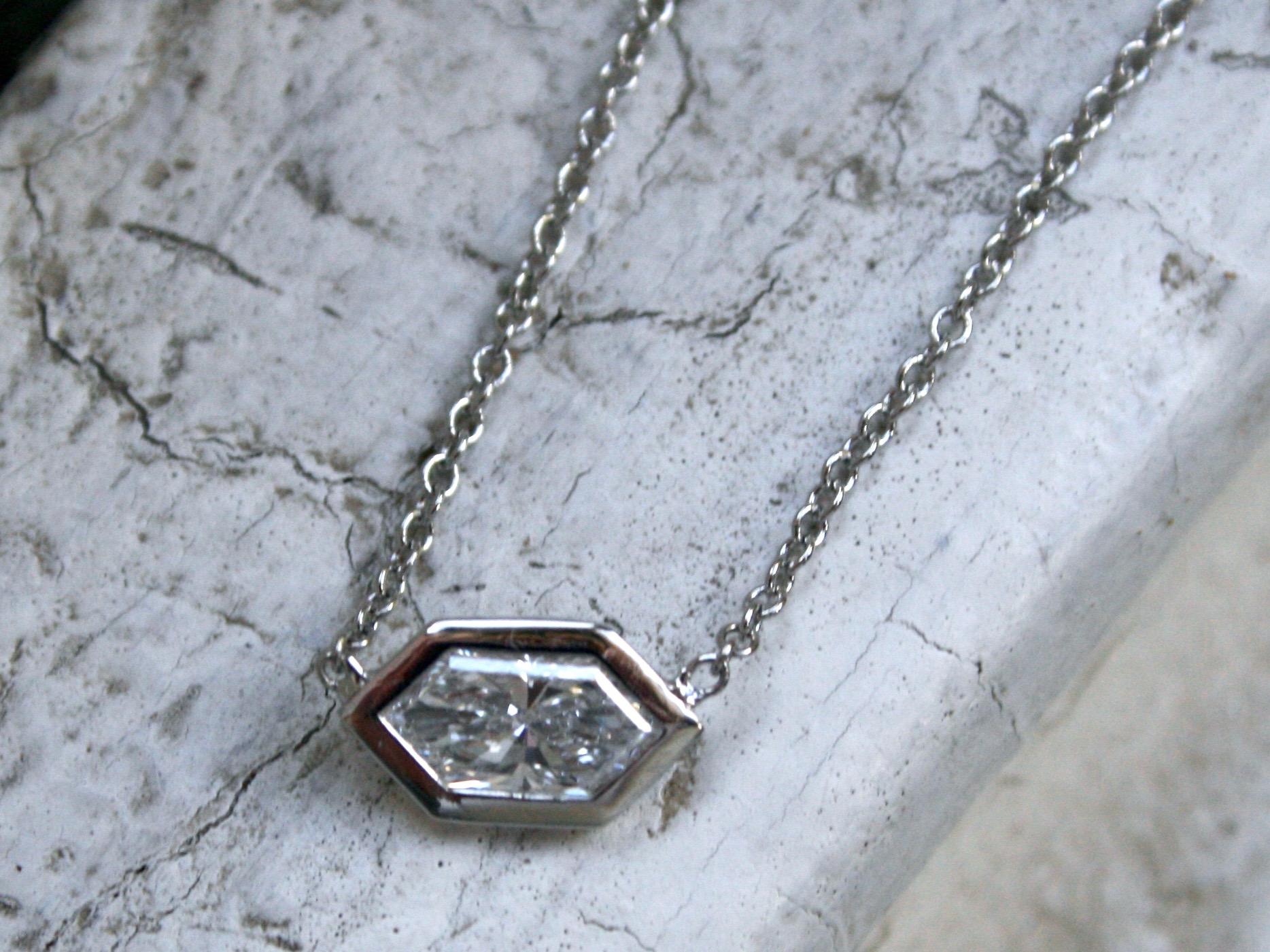 I so love this Fantastic Platinum Diamond Solitaire Pendant - if I didn't already have one, this would be on my neck! The design is simple bezel set diamond on a classic link chain. In the center, the pedant hold one Hexagon Cut Diamond, 0.50ct in