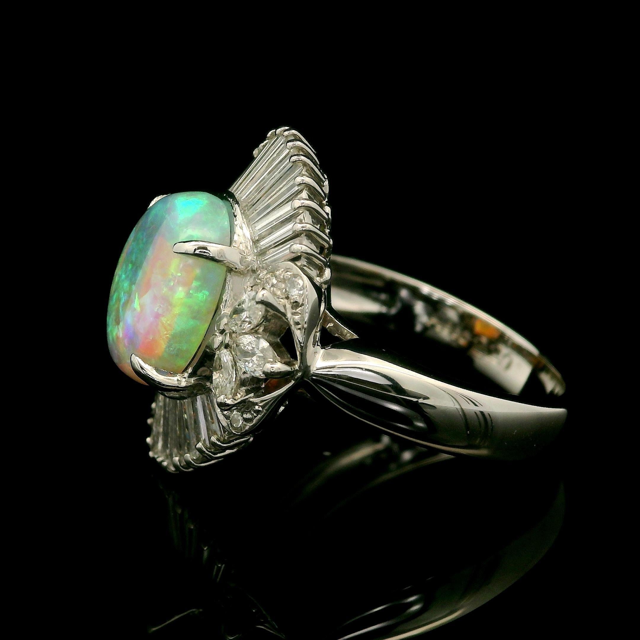 --Stone(s):--
(1) Natural Genuine Opal - Oval Cabochon Cut - Prong Set - Fiery Very Nice Color w/ Excellent Play of Colors - 10.6x8.4mm / 2.29ct (exact)
Numerous Natural Genuine Diamonds - Marquise, Baguette & Round Brilliant Cut - Prong Set - Very