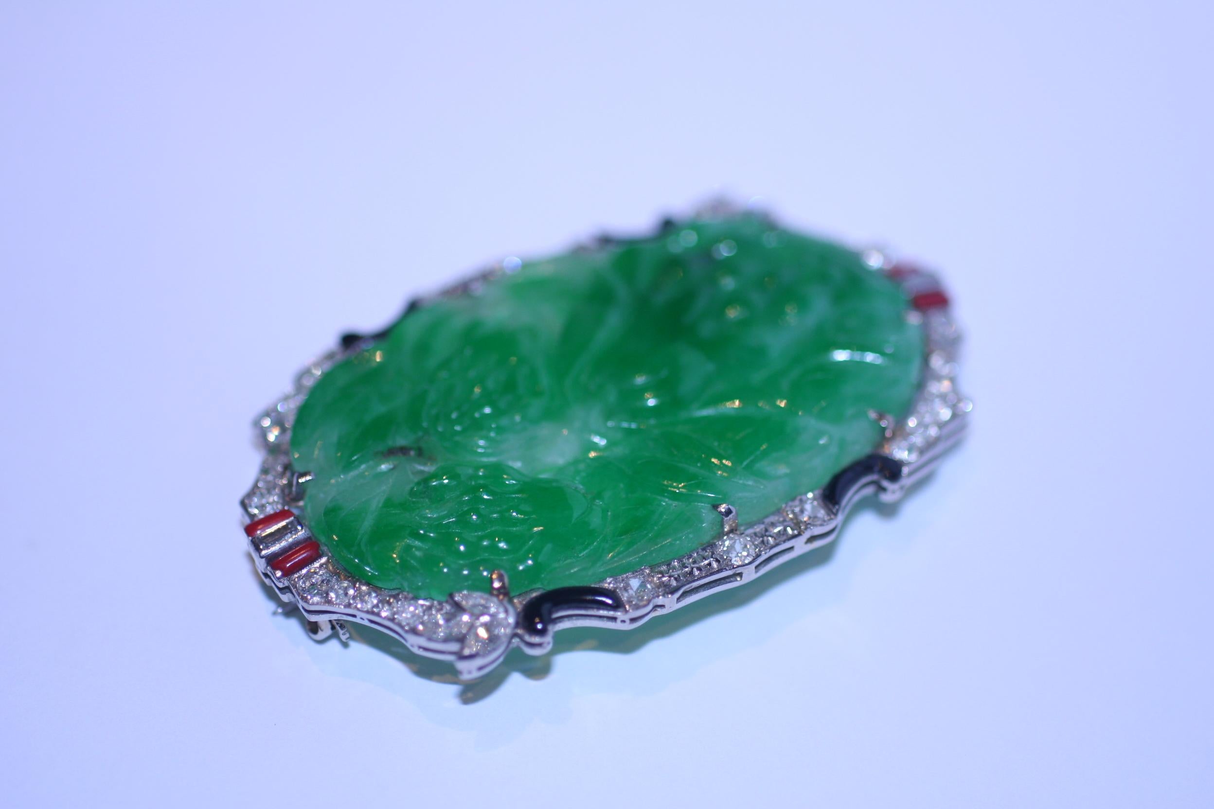 Handmade Art Deco Jade Brooch finely crafted in Platinum with Round Brilliant Cut Diamonds.