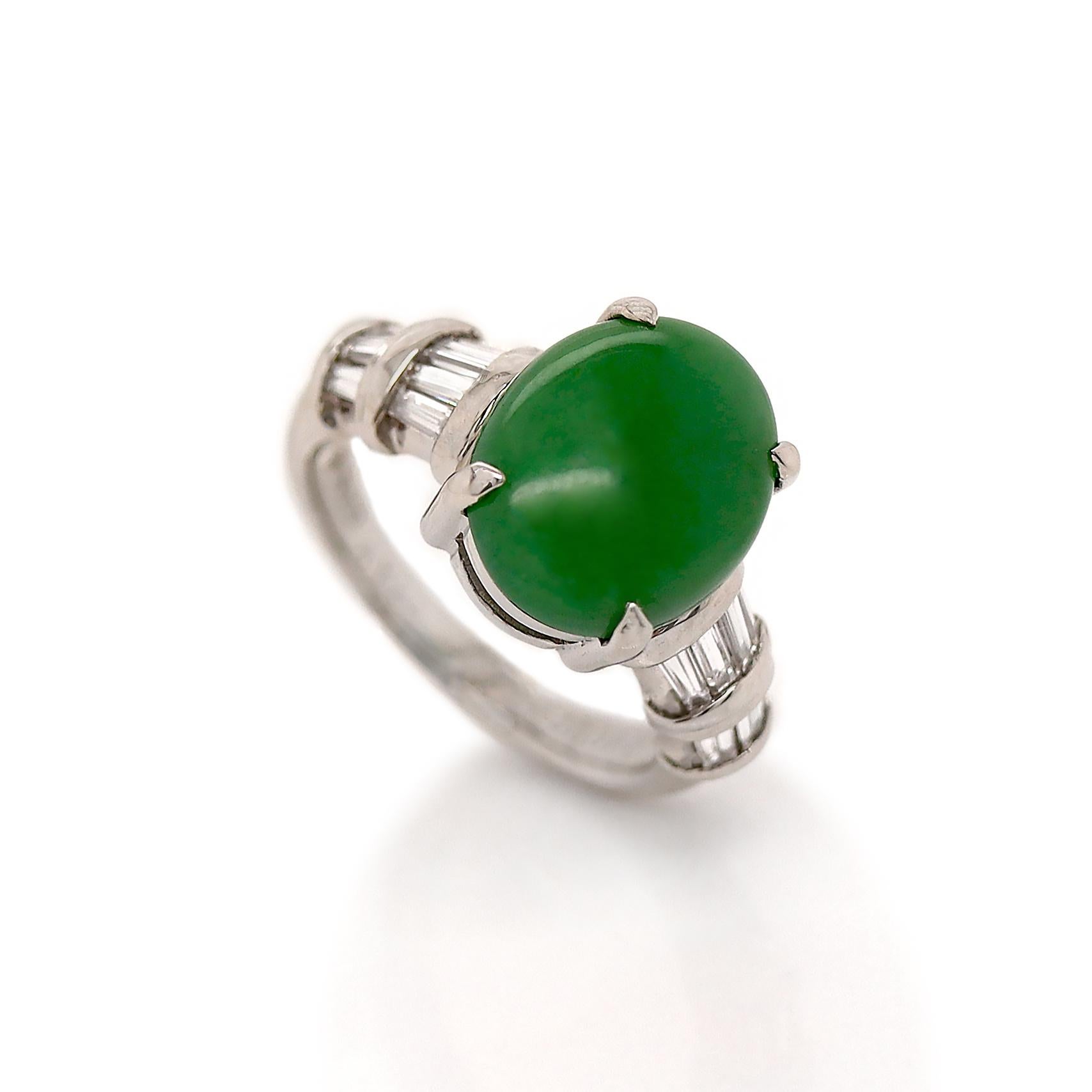This exquisite piece features a fine green Jadeite Jade, characterized by its medium tone and translucent clarity. The Jade is expertly cut into an elegant oval cabochon, showcasing its rich, natural color variations.

Flanking the Jade are fourteen