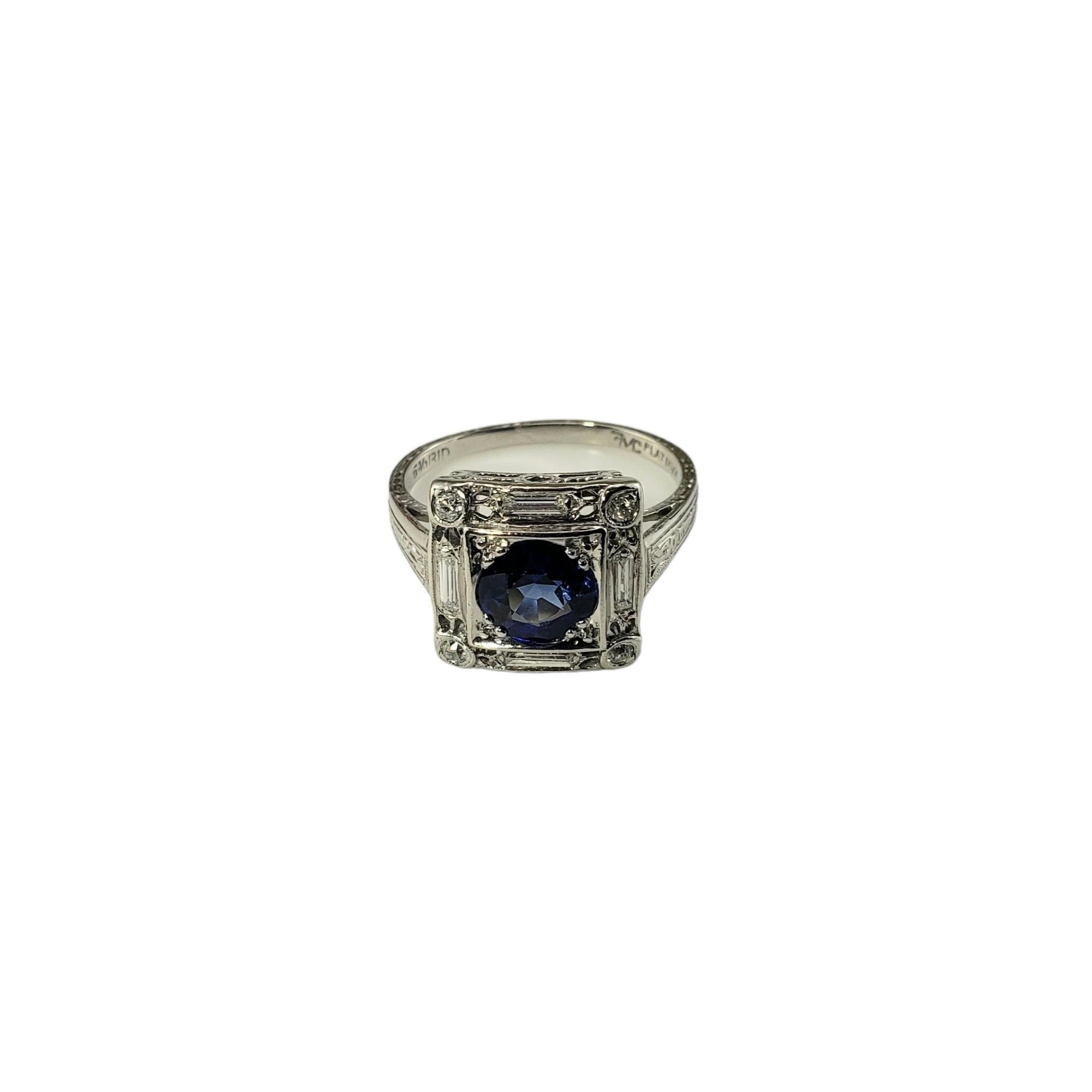 Vintage Platinum Lab Created Sapphire and Diamond Ring Size 6 JAGi Certified-

This elegant ring features one round lab created sapphire, four round brilliant cut diamonds and four baguette diamonds set in classic platinum.  Width: 11.8 mm.
Shank: