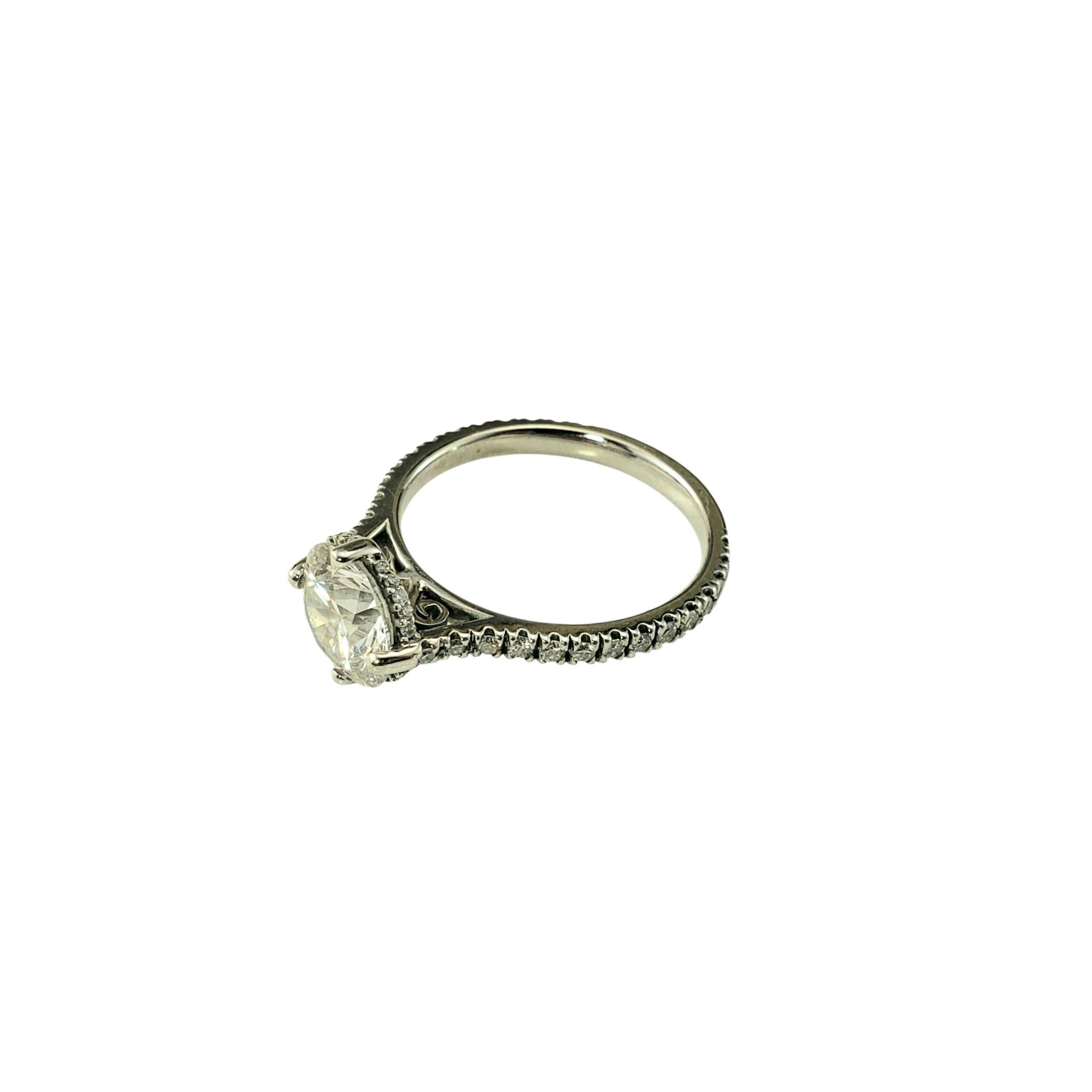 Platinum Lab Grown Diamond Engagement Ring Size 7

This elegant engagement ring showcases a stunning 2.1 carat round brilliant lab-grown diamond set in classic platinum. The setting is finely crafted with diamond accents along the shoulders and band