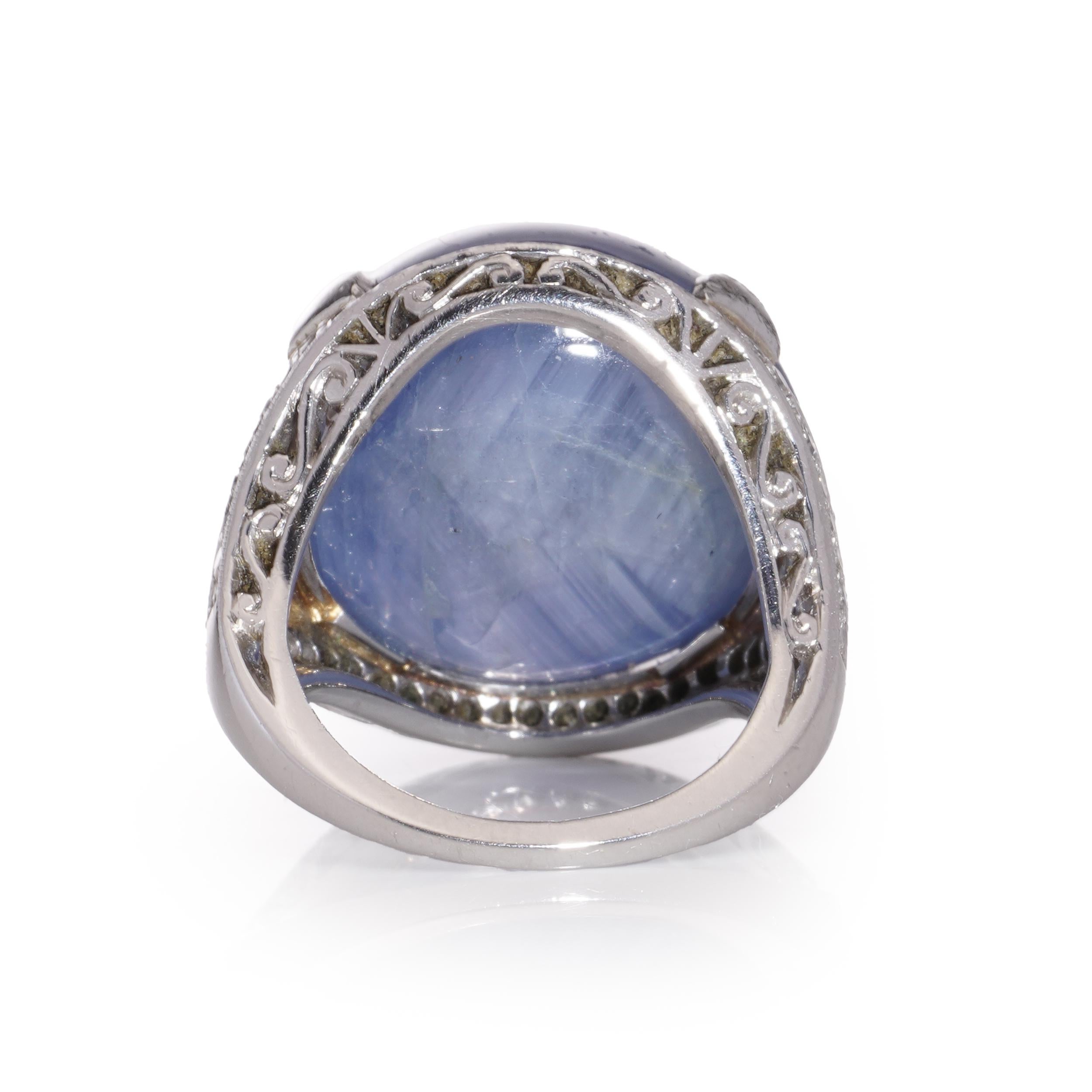 Platinum ladies' dome ring with approximately 46 cts. of round cabochon sapphire and diamond ring. 
X - Ray has been tested positive for platinum purity. 

Dimensions - 
Finger Size (UK) = H (EU) = 47 (US) = 4
Weight: 19 grams
Ring Size: 2.9 x 2.4 x