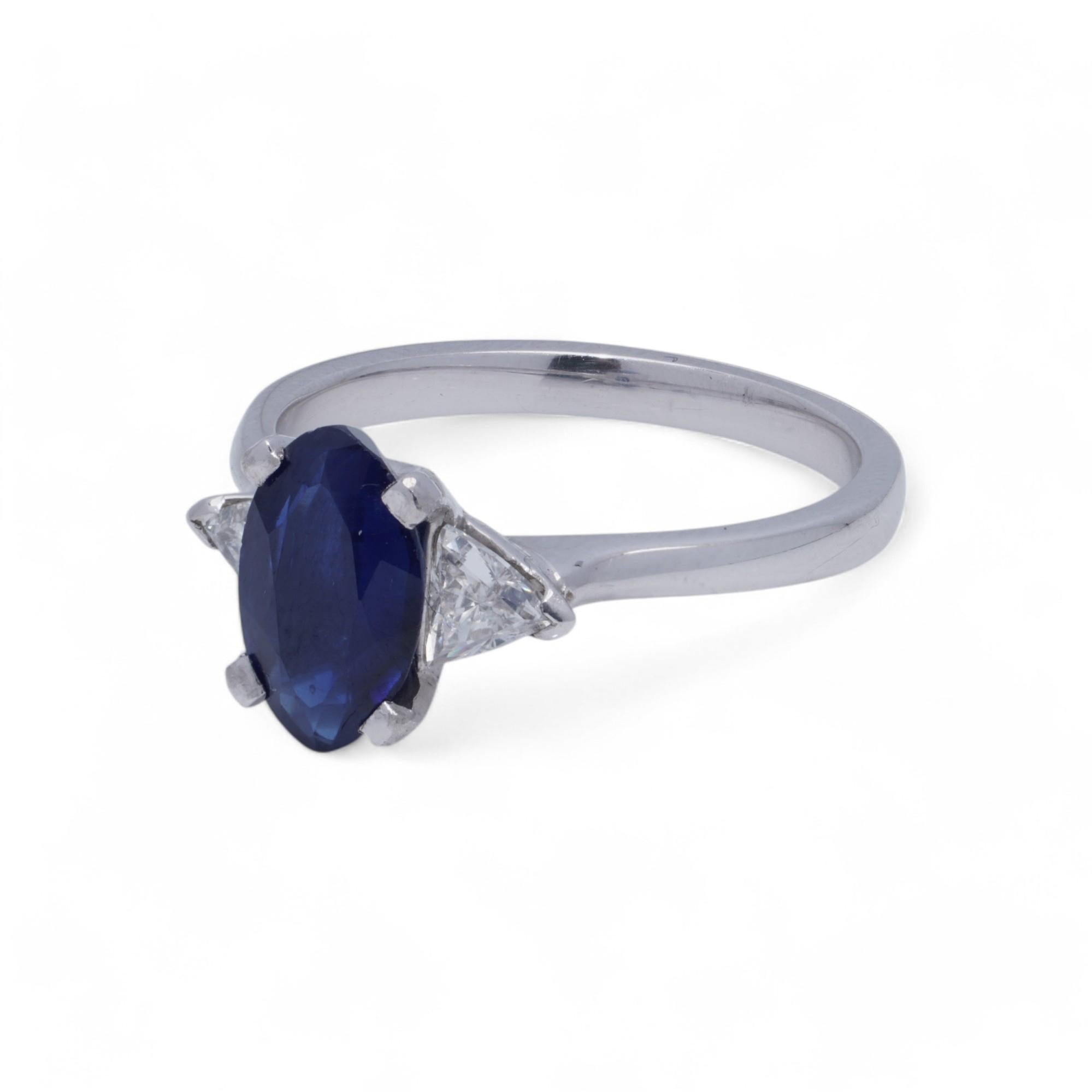 Marquise Cut Platinum Ladies Ring with Blue Sapphire and Trillion Cut Diamonds For Sale