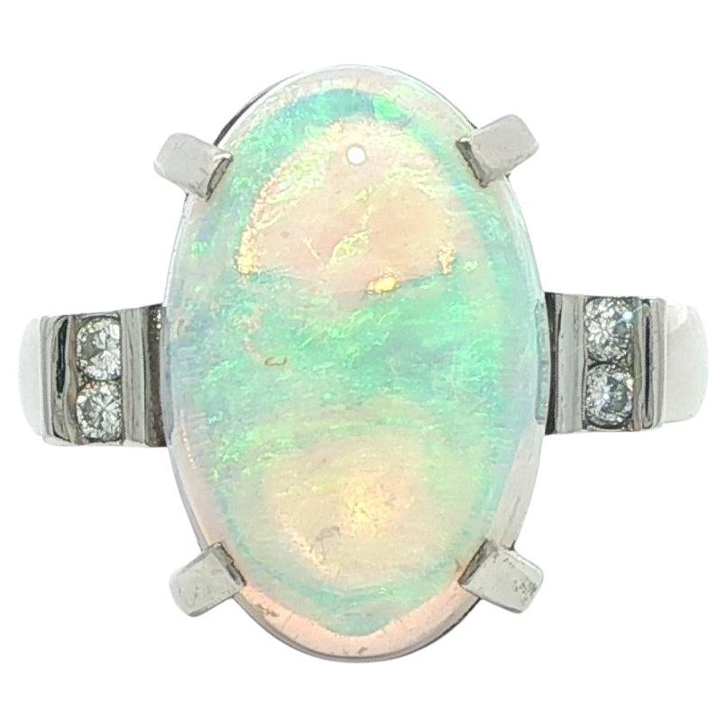 Platinum Long Elongated Colorful Play of Color Oval Opal Diamond Sides Ring For Sale