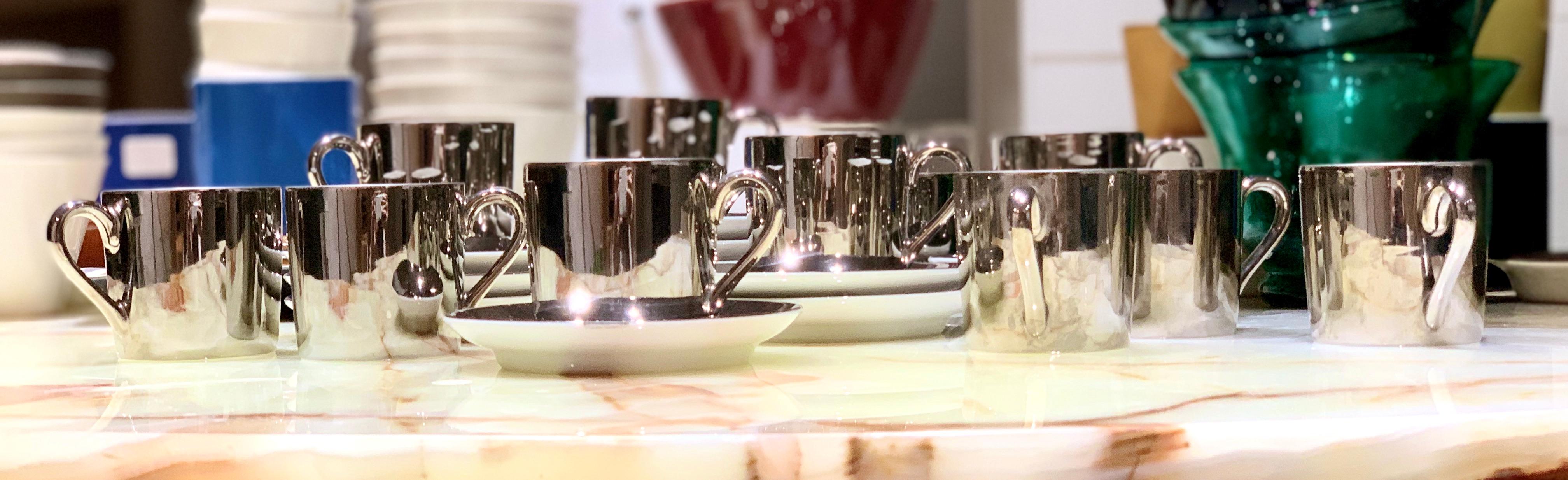 Set of twelve George Jensen Demitasse cups. Georg Jensen, in white body with platinum lustre glaze. Cup 2