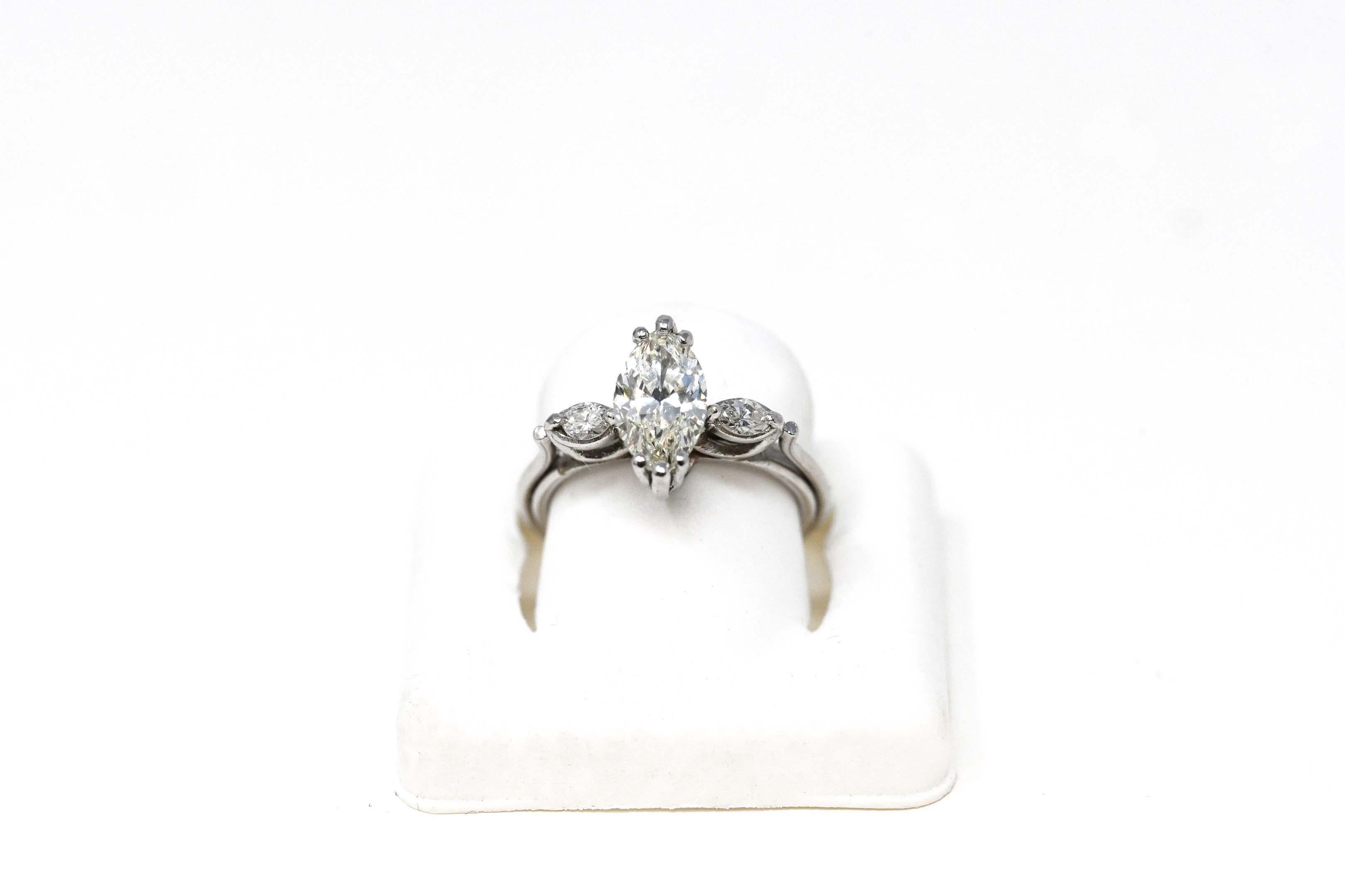 One (1) ladies ring in platinum (by acid test) classic style, polished finish, total weight of 5.5 grams. The ring is set with: One (1) marquise cut diamond, the weight: 1.26 carat. Measures 10.00 x 5.75 mm, depth 3.45mm. Clarity VVS2. Color H-I.