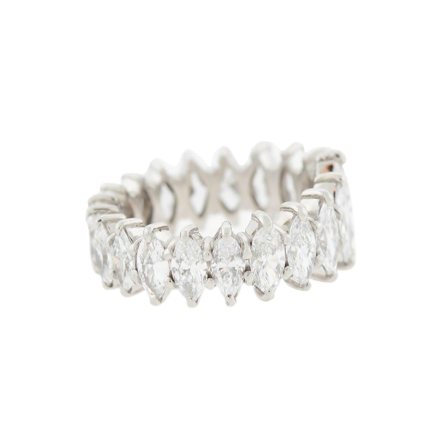 A stunning diamond eternity band from the 1960s era! Crafted in platinum, this unique ring features a glittering row of Marquise Cut diamonds that subtly graduate in size towards the back. With 20 diamonds in total, each stone is held by prongs and