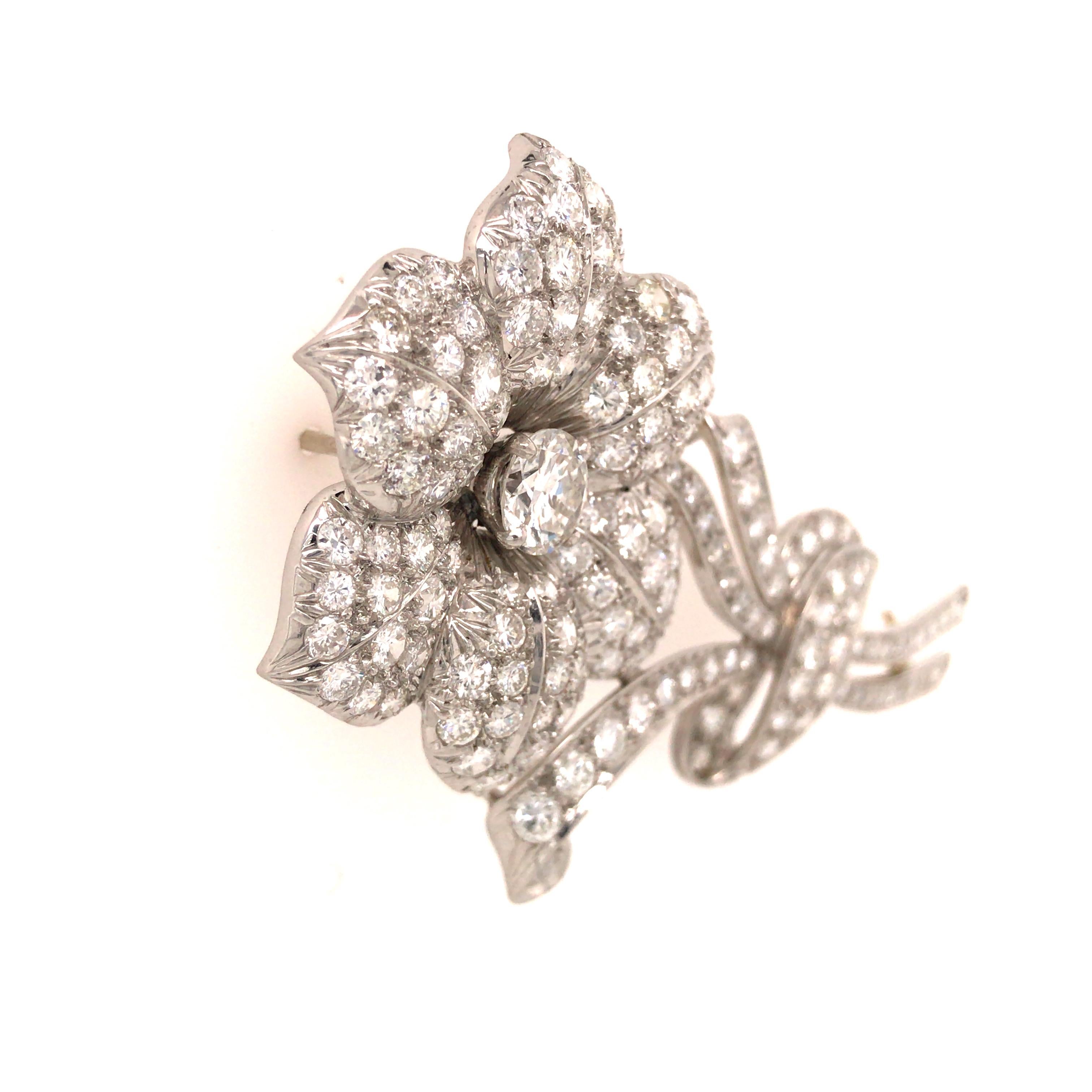Maurice Tishman Diamond Flower Pin in Platinum.  Round Brilliant Cut Diamonds weighing approximately 8 carat total weight, G-H in color and VS-SI in clarity are expertly set.  The Pin measures 2 5/8 inch in length and 1 1/4 inch at the widest point.