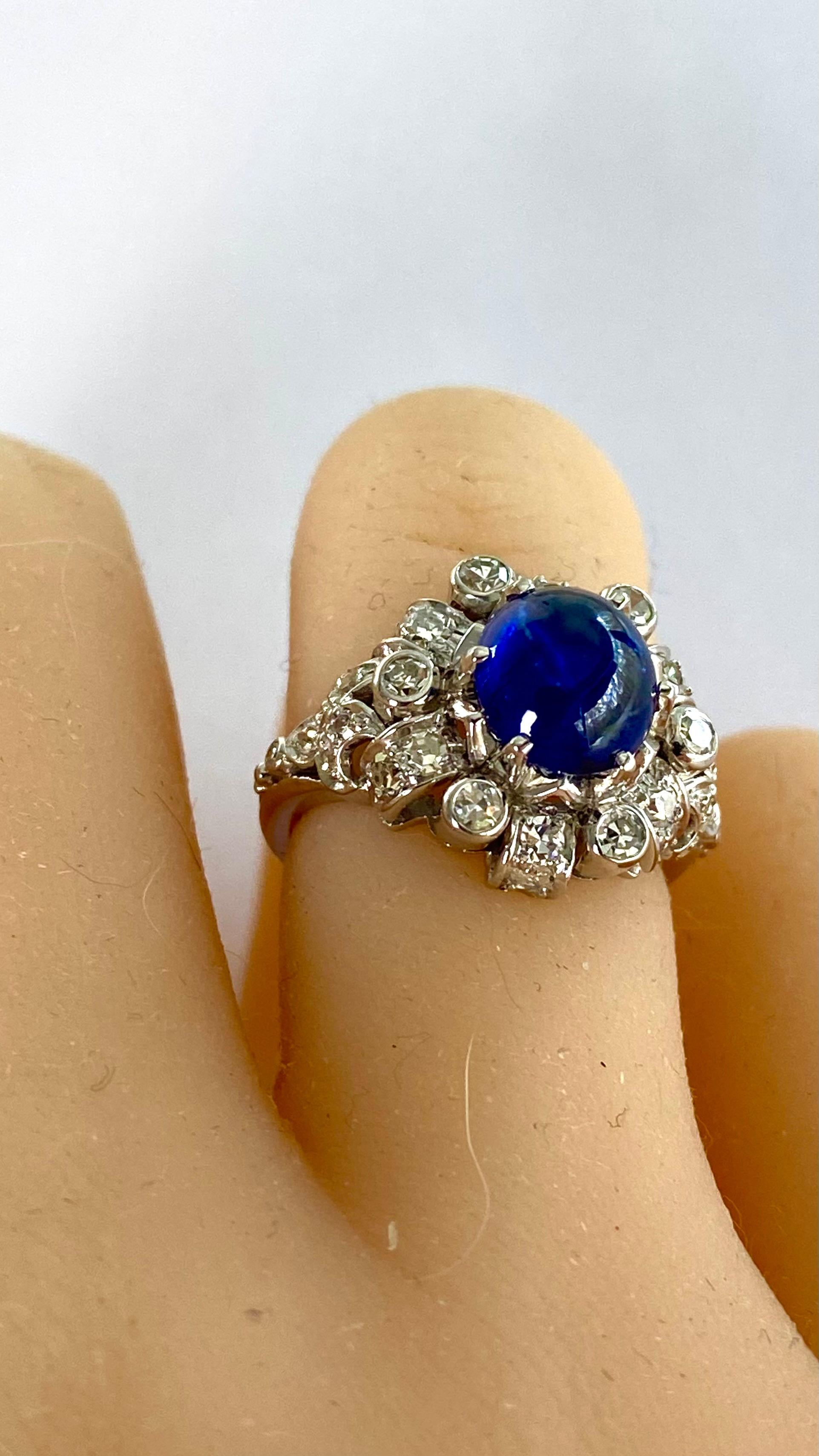 Step into timeless elegance with our exquisite Mid Century Platinum Ceylon Cabochon Sapphire Ring, a masterpiece destined to captivate the most discerning of tastes. Crafted with the utmost precision and finesse, this opulent ring is a celebration