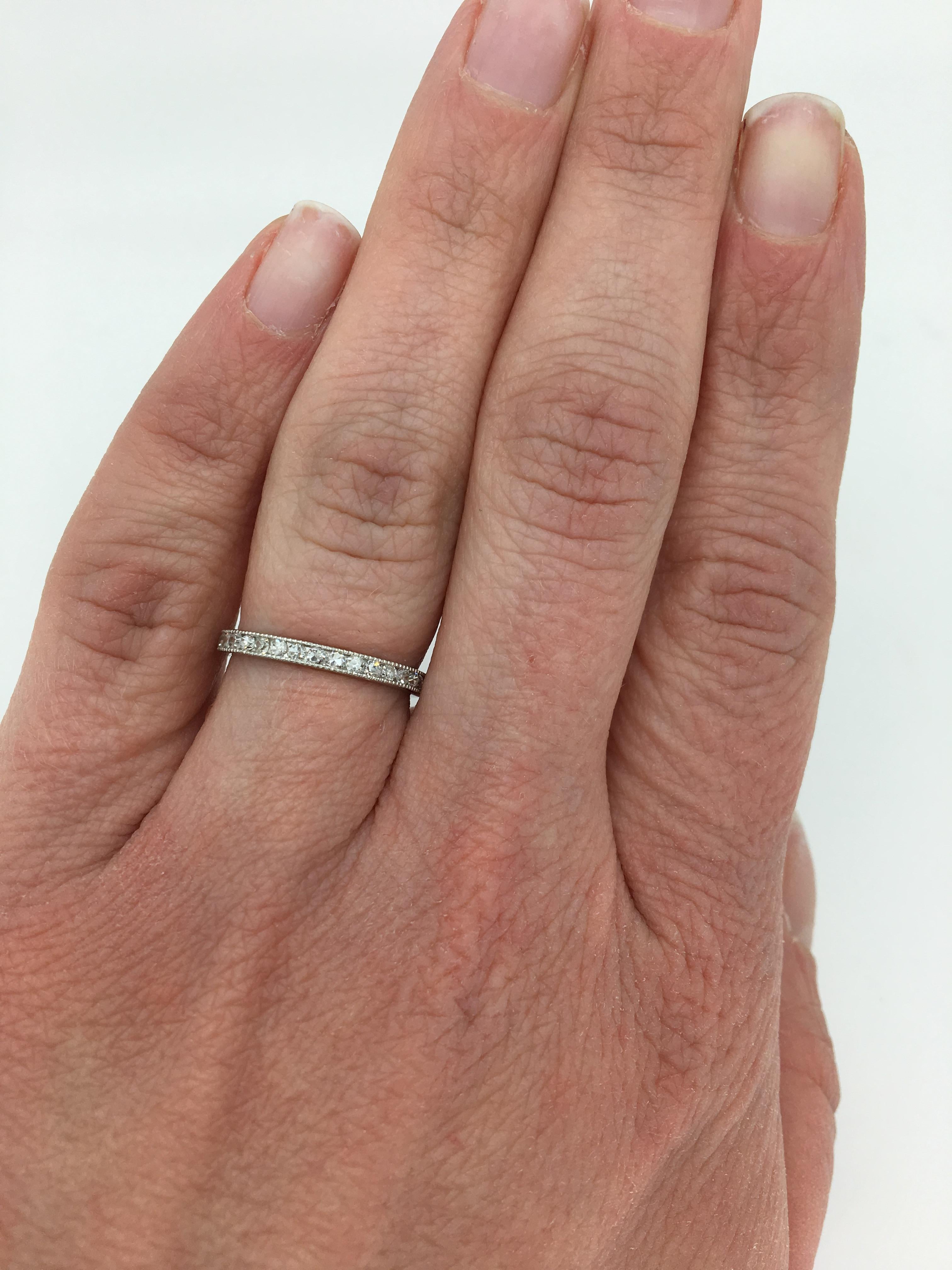 Platinum diamond eternity band with mil-grain detail.

Gemstone: Diamond
Diamond Carat Weight: Approximately .70ctw
Diamond Cut: Single Cut
Color: Average G-H
Clarity: Average SI-I
Metal: Platinum
Marked/Tested: Tested Platinum
Weight: 1.5