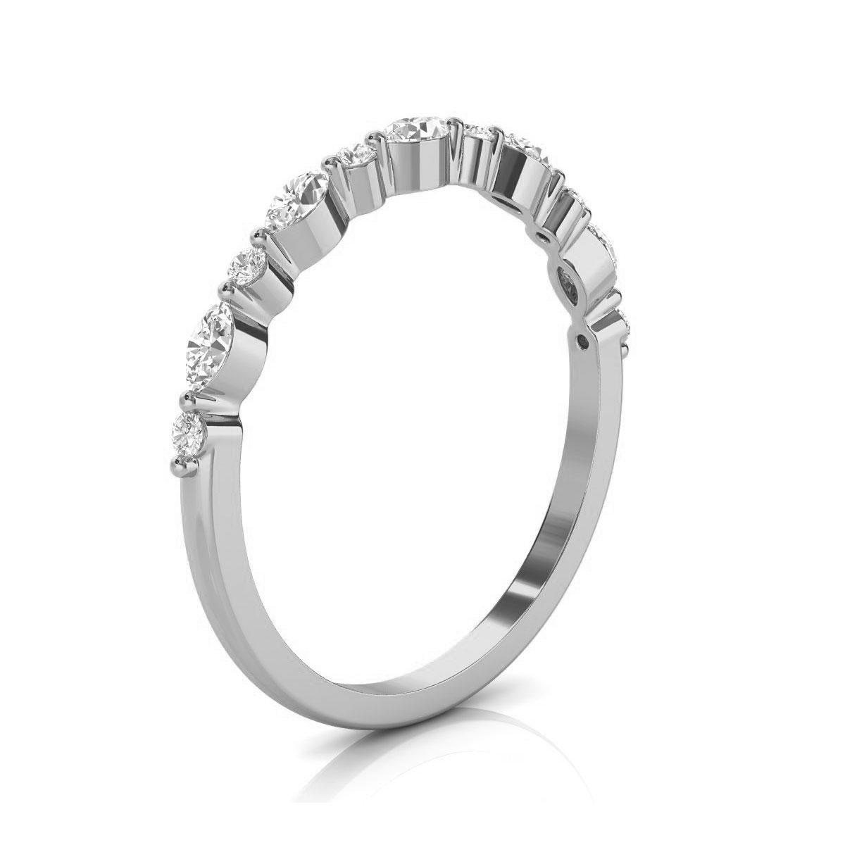 This minimalist ring features alternating round brilliant and marquise shape diamonds prong set on thin metal. It's stackable, and our customers love it! Experience the difference in person!

Product details: 

Center Gemstone Color: WHITE
Side