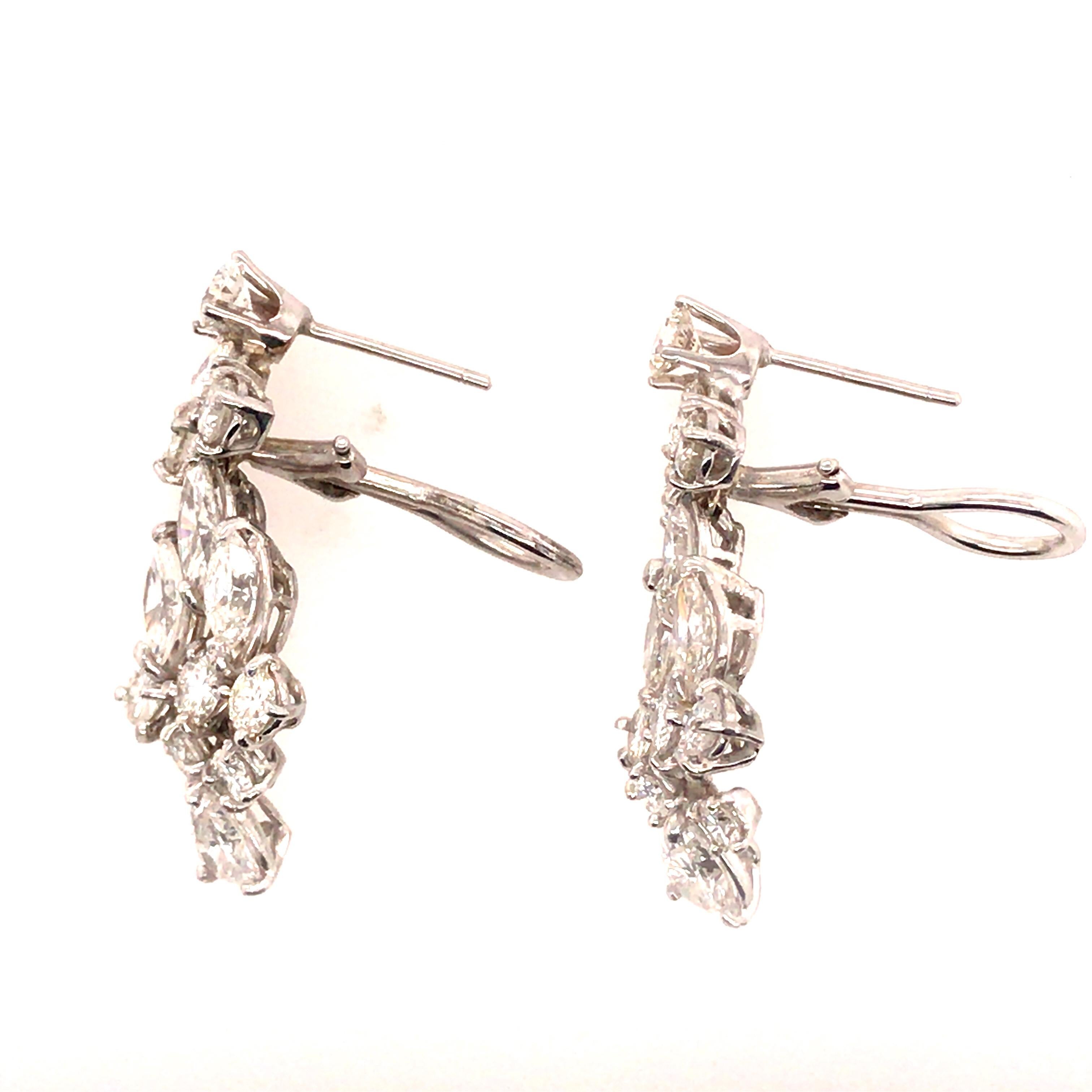 Multi-Shape Diamond Hanging Earrings in Platinum.  (18) Round Brilliant Cut, (6) Marquise and (2) Pear Shape Diamonds 6.20 carat total weigh, G-H in color and VS in quality are expertly set.  The earrings measure 1 1/4 inch in length and 1/2 inch in