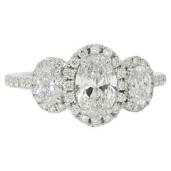 Platinum Natural 1.47 Carat Oval Cut Diamond 3 Stone Halo Engagement Ring