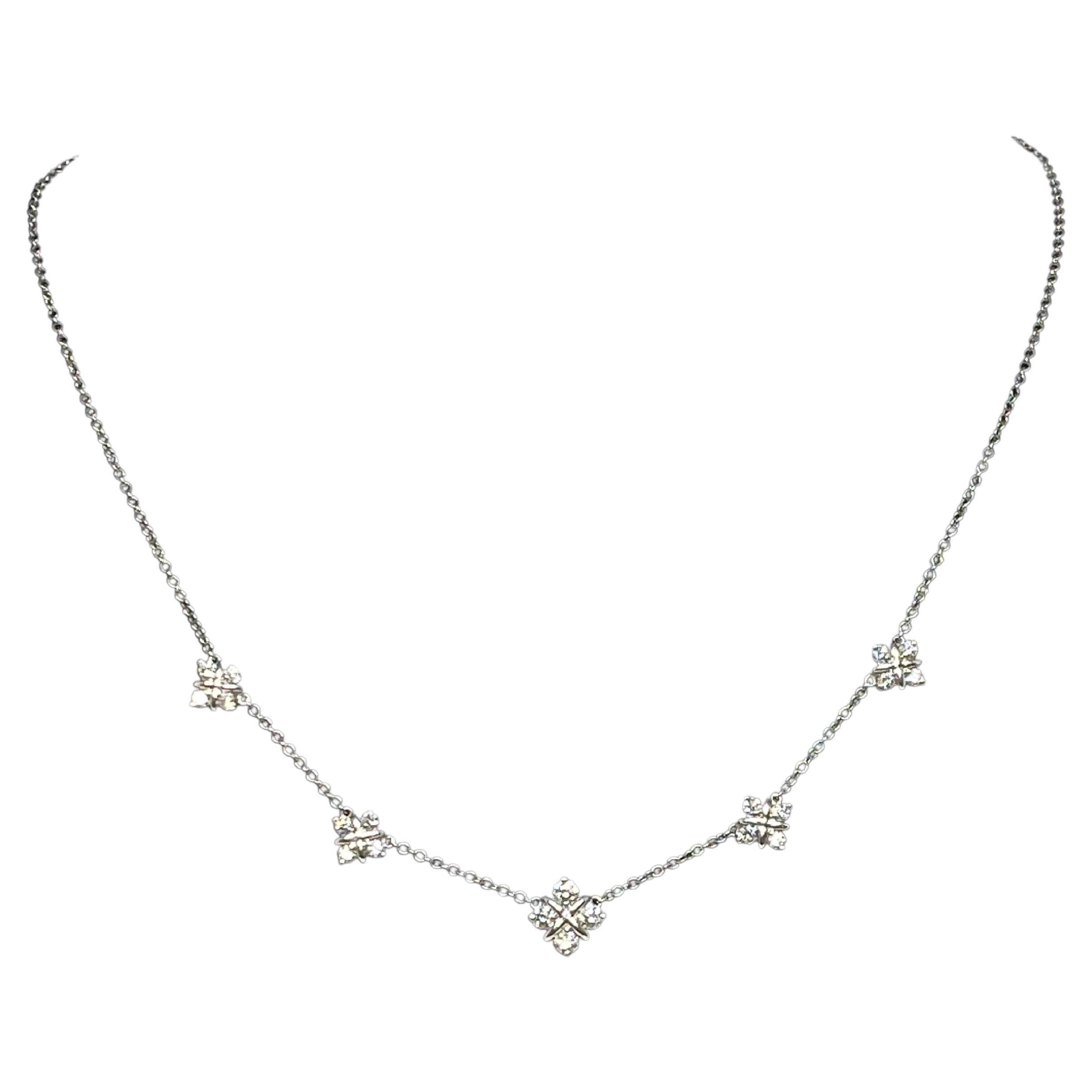 This beautiful diamond necklace is a timeless piece that epitomizes elegance and understated luxury.

This necklace features five sparkling stations of diamond  consisting of 4 diamonds per cluster. The main and middle cluster being the largest.