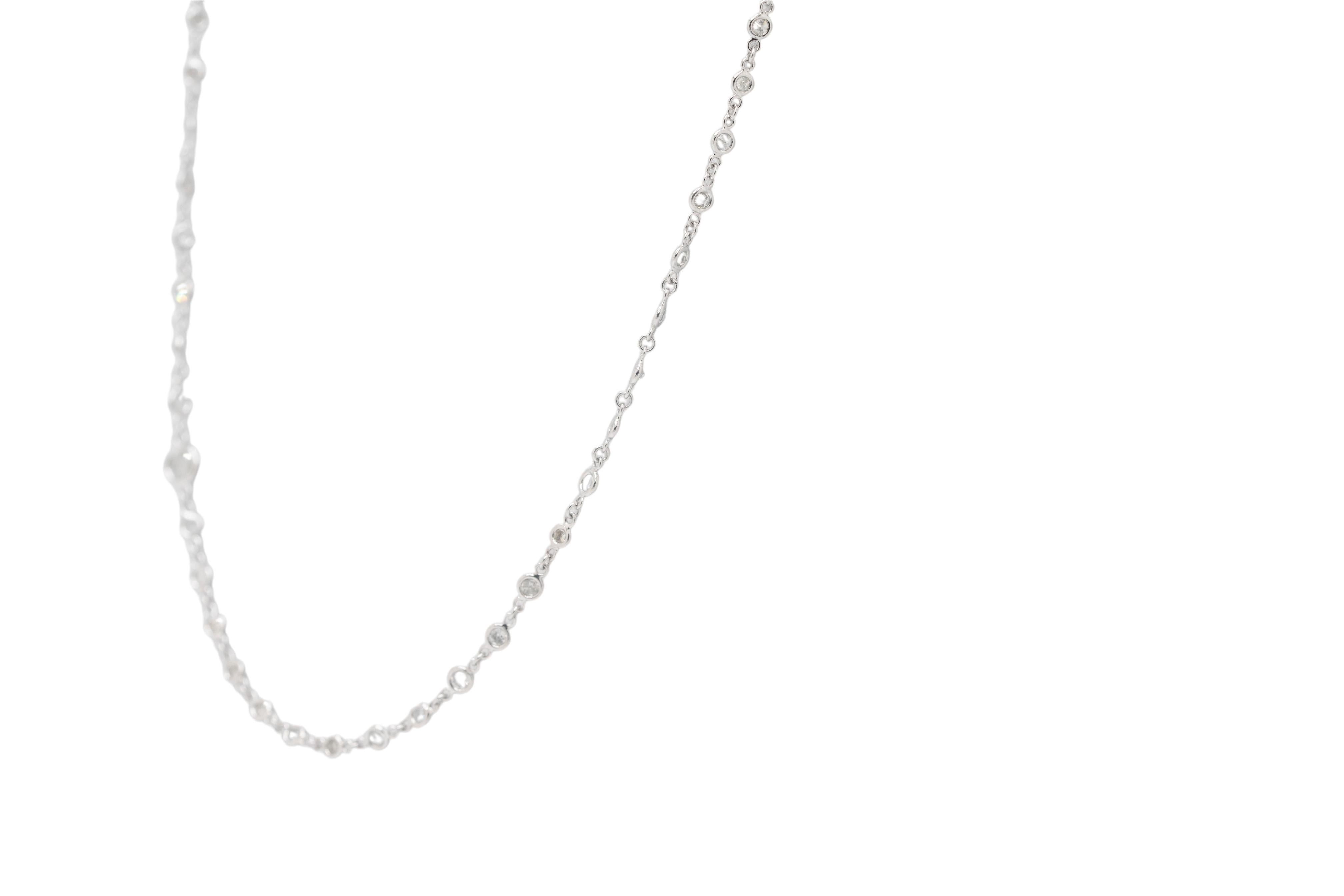 This Platinum 18-Inch Diamonds by the Yard Necklace brings elegance and sophistication with approximately 2.7 carats total weight of dazzling round diamonds. Each diamond is meticulously bezel-set along the length of the platinum chain, adding a