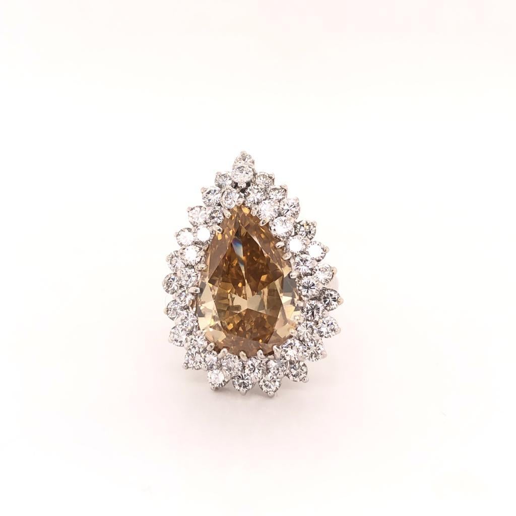Double Halo Fancy Natural Yellow Brownish Pear Shape Platinum Diamond Ring In Excellent Condition For Sale In Aventura, FL