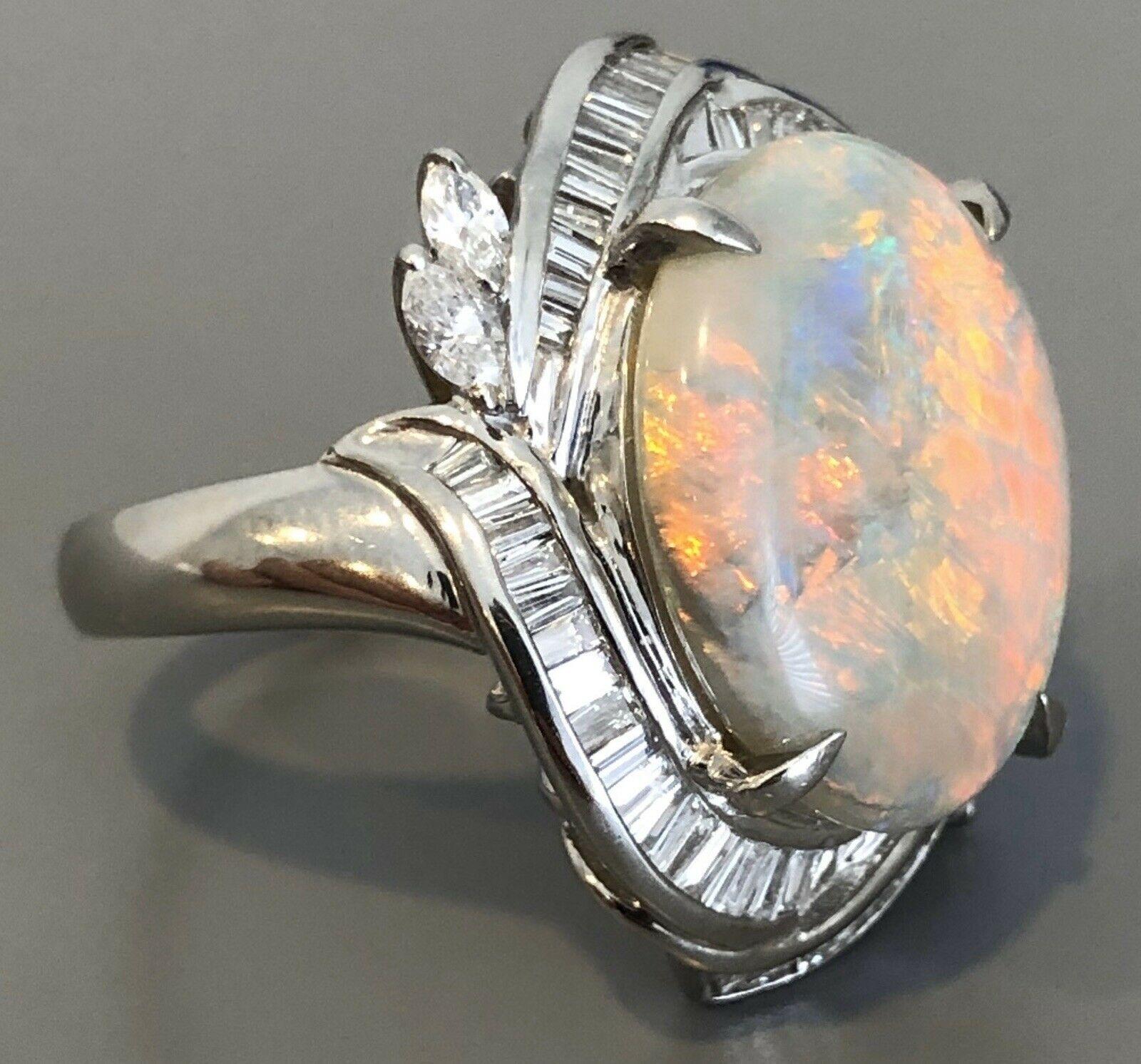 Platinum, Natural Opal & Diamond Ring 7.57ctw 14.5g  

Very elegant for everyday wear !! 

Approx 1.15 ctw of g-h vs diamonds 

Natural opal approx ct 6.42



 100% NATuRAL  

Size 5.25

Weight 14.5 grams