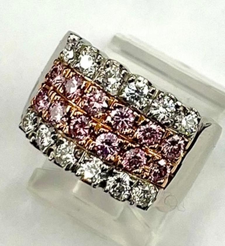 This is a classic 4 row band set with natural pink and white diamonds. There are 12 Round Natural Pink Diamonds of .84Ct Total Weight and 12 Round Natural White Diamonds of .79Ct Total Weight. Most natural pink diamonds are quite light in color --