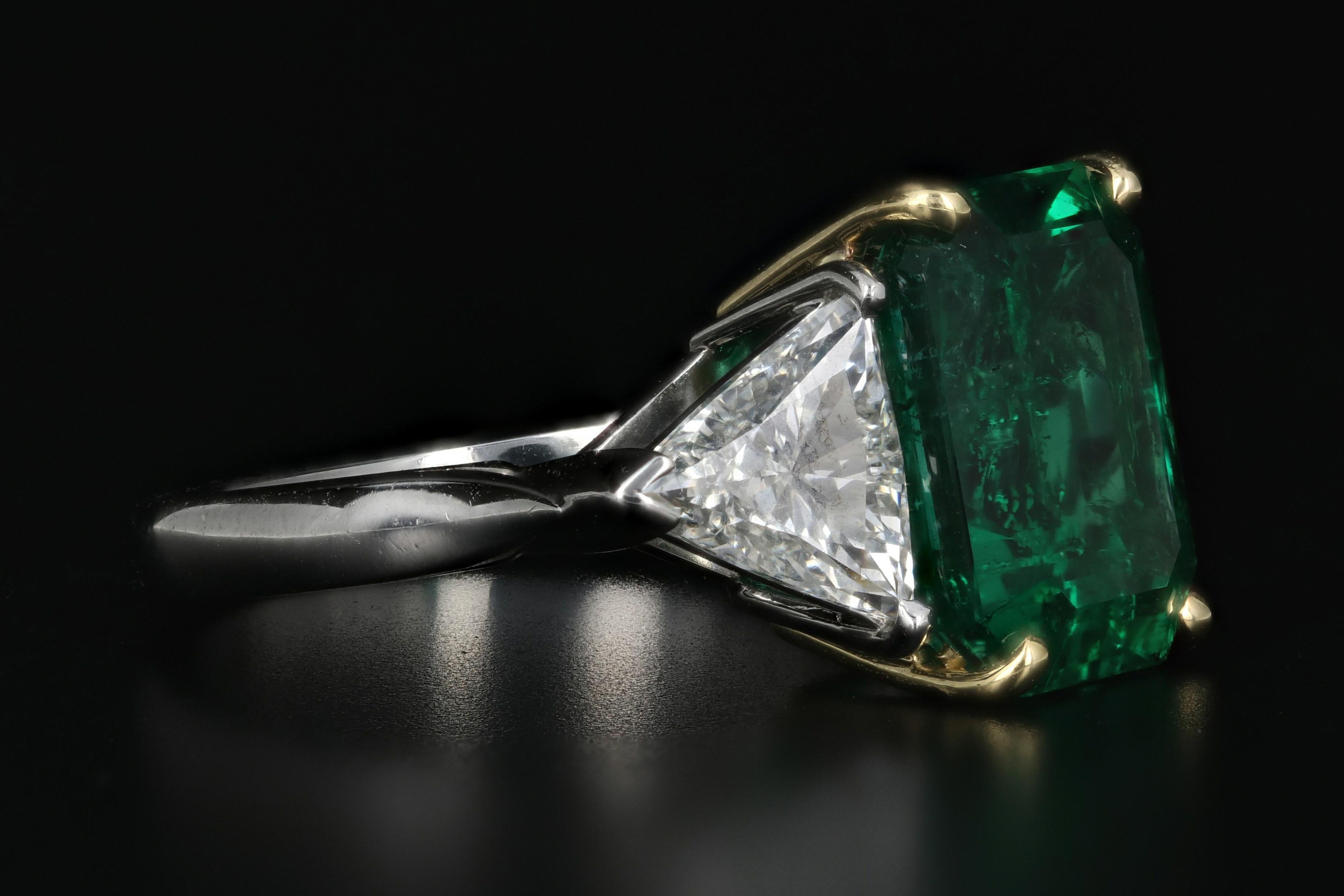 emerald cut diamond with trillion side stones