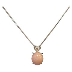 Platinum Necklace with Conch Pearl 
Diamond Accent Pendant