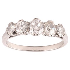 Anillo de cinco piedras con diamantes talla antigua en platino