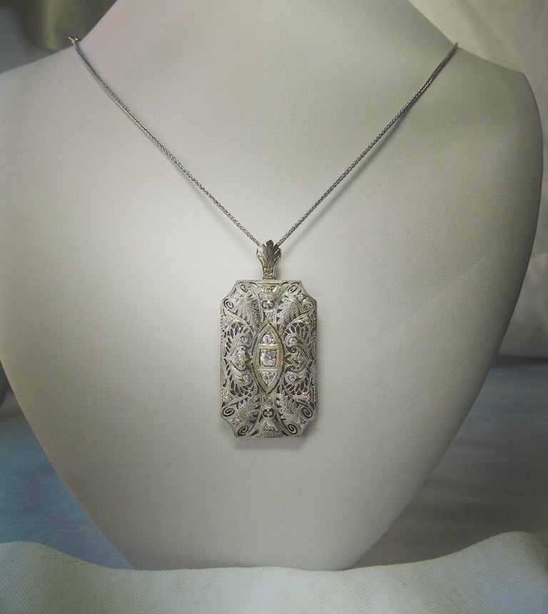 A stunning museum quality Victorian - Edwardian Platinum Diamond Lavaliere Pendant with 21 sparkling white Old Mine Cut Diamonds of great beauty in a gorgeous platinum openwork filigree leaf motif pendant necklace.  This original