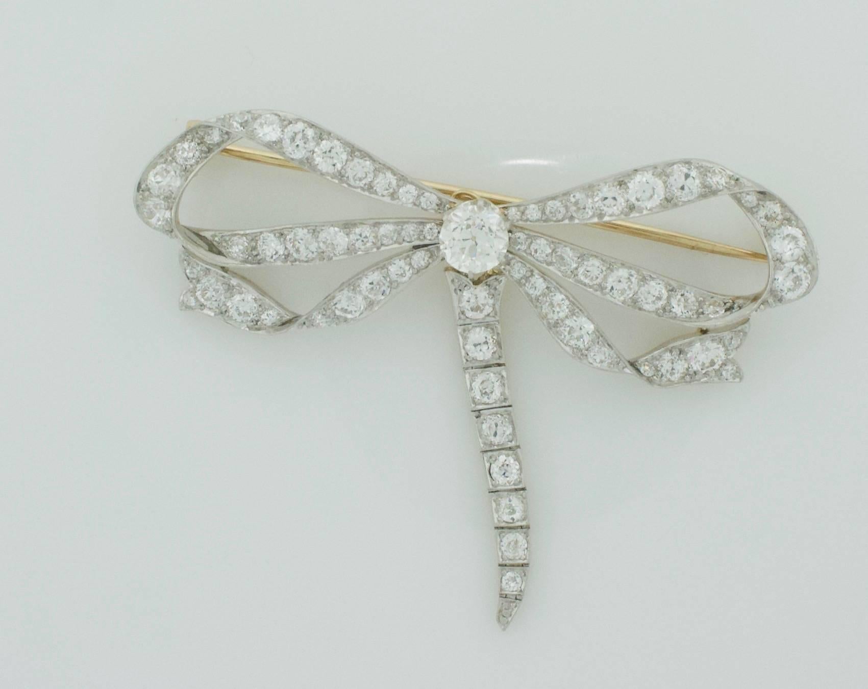 Platinum on 18k Yellow Gold Bow Brooch Circa 1910
Weighing in Just Shy of Seven carats
This Exceptional Bow Brooch has a Dangling (Removable Attachment)  Which Gives Th Wearer Two Distinct Looks