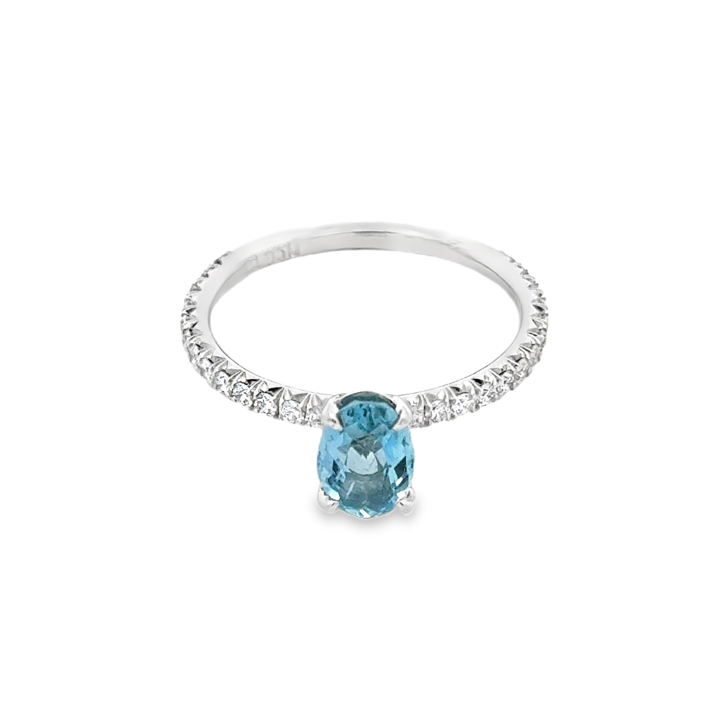 Expertly crafted with a stunning 1.69 carat oval aquamarine, this cocktail ring exudes a sense of elegance and sophistication. The beautiful aquamarine gemstone is sure to catch the eye and add a touch of glamour to any outfit. Perfect for any