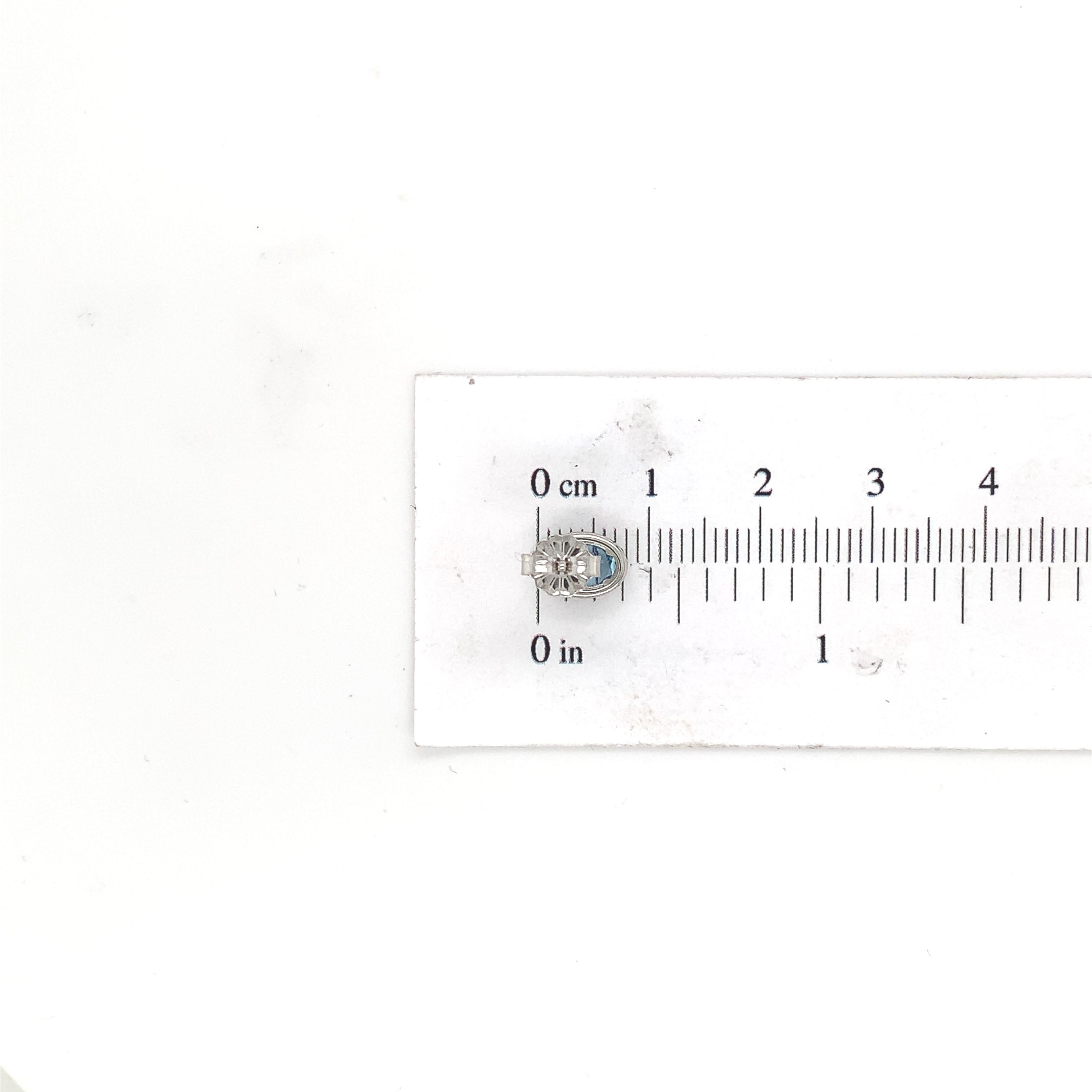 Oval Cut Platinum Oval Aquamarine and Diamond Halo Stud Earrings For Sale