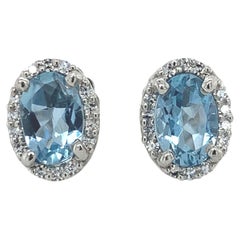 Pendientes Ovalados de Platino con Aguamarina y Halo de Diamantes