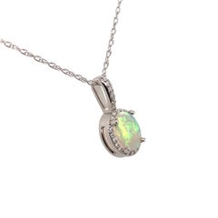 Platinum Oval Australian .60ct Opal and Diamond Halo Pendant with Platinum Chain