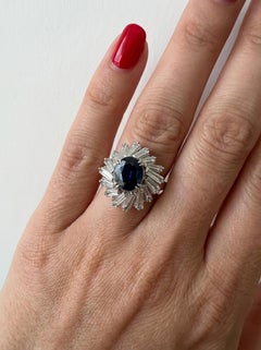 Platinum Oval Blue Sapphire Ring 4.7 Carats with Carats Baguette Diamonds