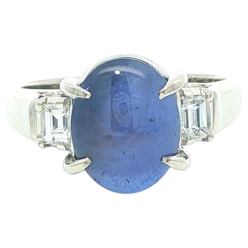 Platinum Oval Blue Star Sapphire Step Cut Diamond Sides Open Gallery Ring For Sale