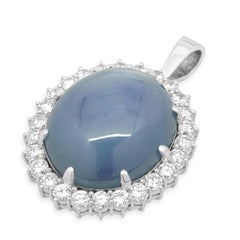 Platinum Oval Cabochon Cut Blue Star Sapphire and Round Diamond Halo Pendant