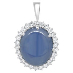 Platinum Oval Cabochon Cut Blue Star Sapphire and Round Diamond Halo Pendant