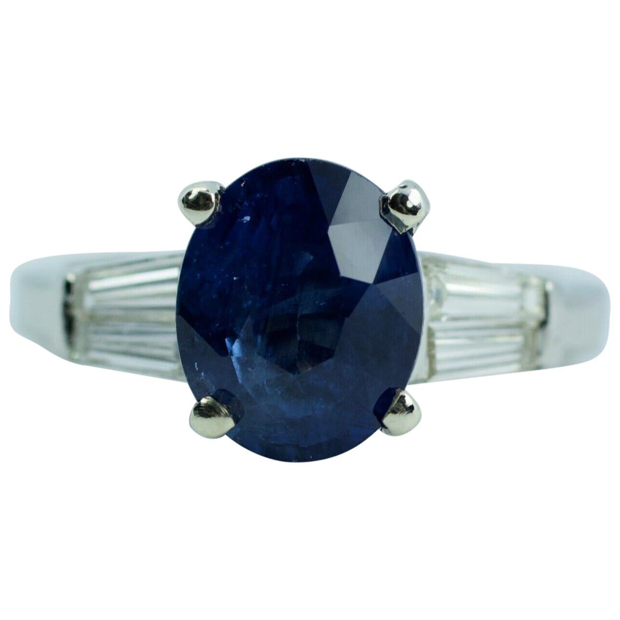 Platinum Oval Ceylon Blue Sapphire and Tapered Baguette Diamond Ring