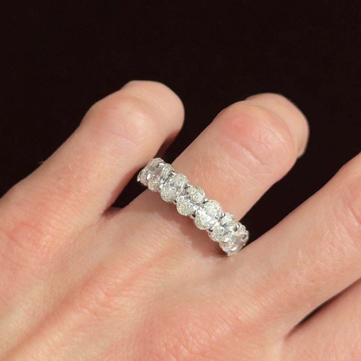 Indulge in the exquisite beauty of the Platinum Ring set with oval-cut diamonds. Crafted from luxurious platinum, this ring exudes timeless elegance and unparalleled craftsmanship, making it a radiant addition to any jewelry collection.

The ring