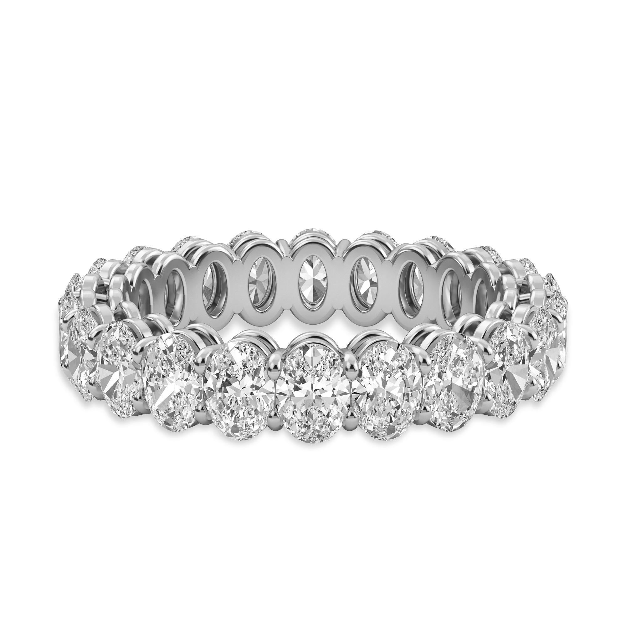 Imagine the look on her face when she sees this Oval Diamond Eternity Band; featuring 22 Oval Diamonds and weighing 3.45 Total Carat Weight. These diamonds are F Color, VS-SI Clarity, and are set in a Platinum setting in a finger size 6.5. 

Need a