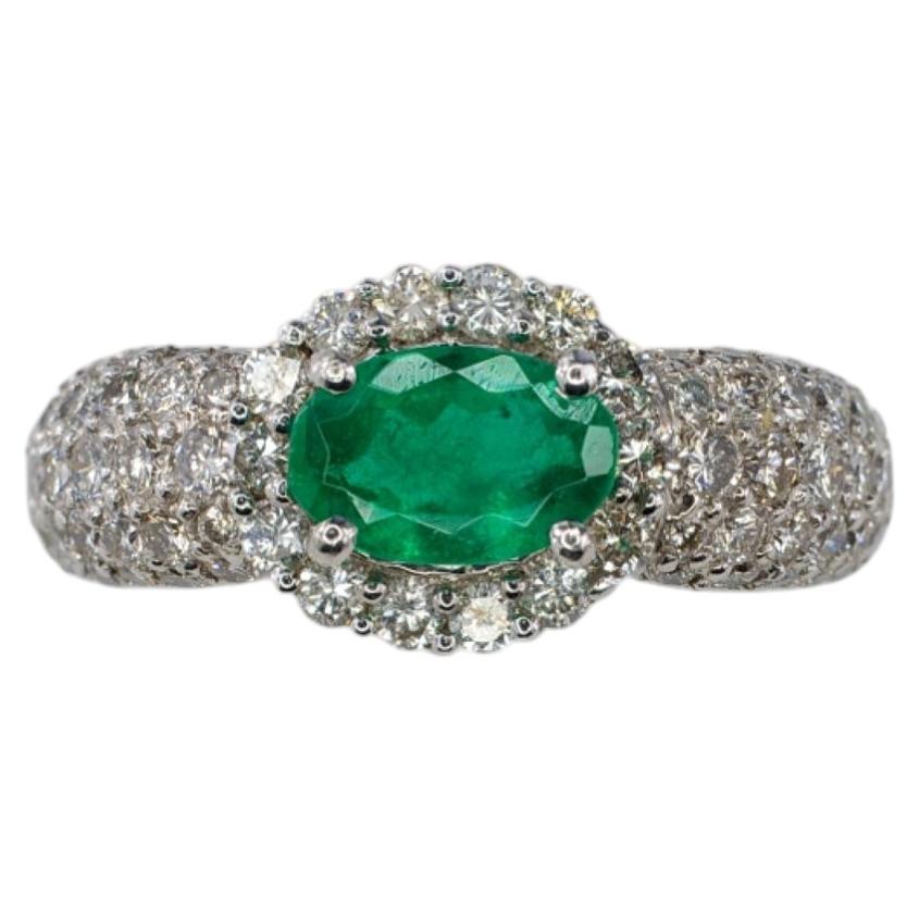 Platinum Oval Emerald and Multi-Row Pavé Diamond Halo Ring