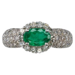 Platinum Oval Emerald and Multi-Row Pavé Diamond Halo Ring