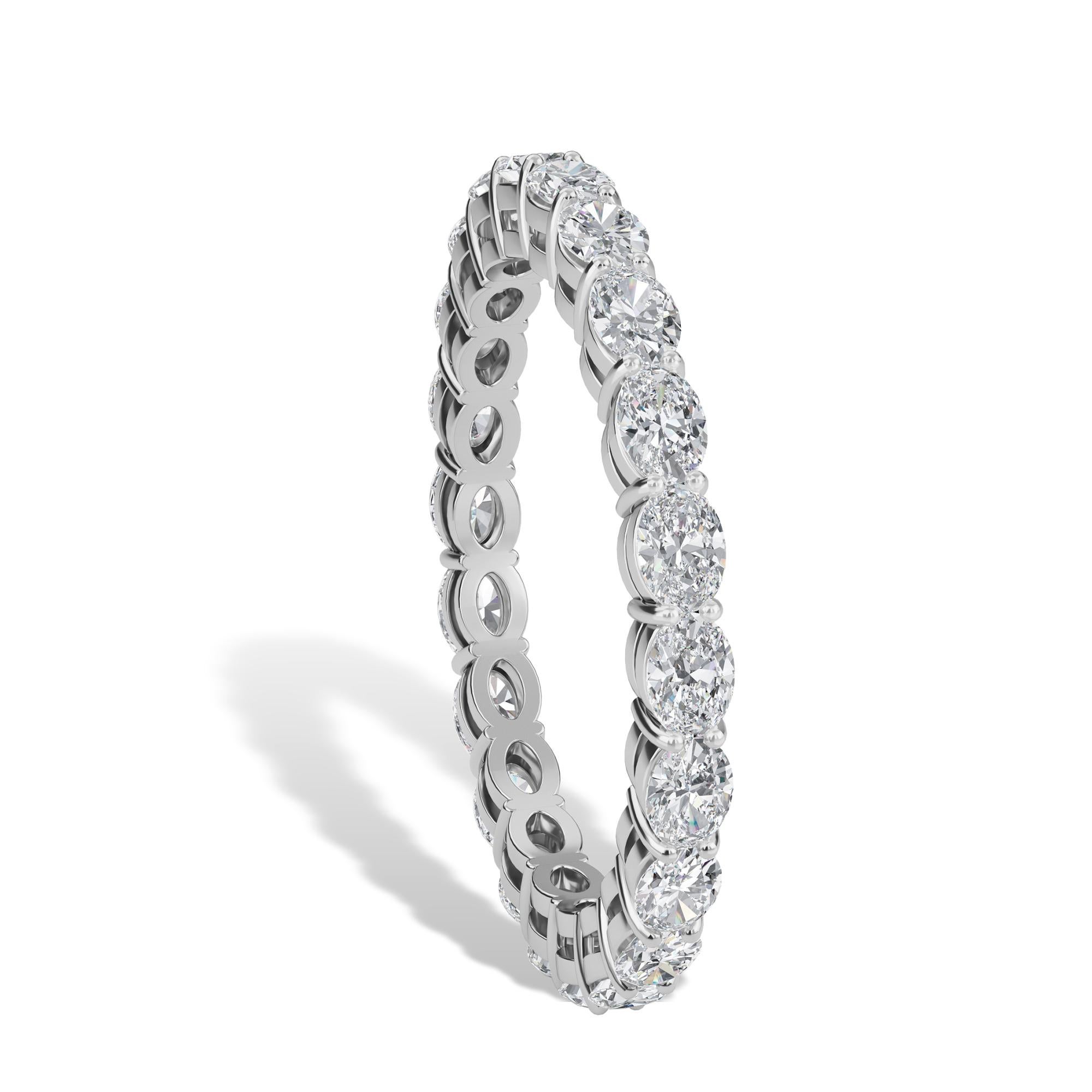 The Oval Horizontal Eternity Band features 22 diamonds, set east west, with a total weight of 1.33TCW. The diamonds are F Color, VS-SI Clarity, and are set in a Shared-Prong Platinum setting, in a Finger Size 6.75. 

Message us for additional finger