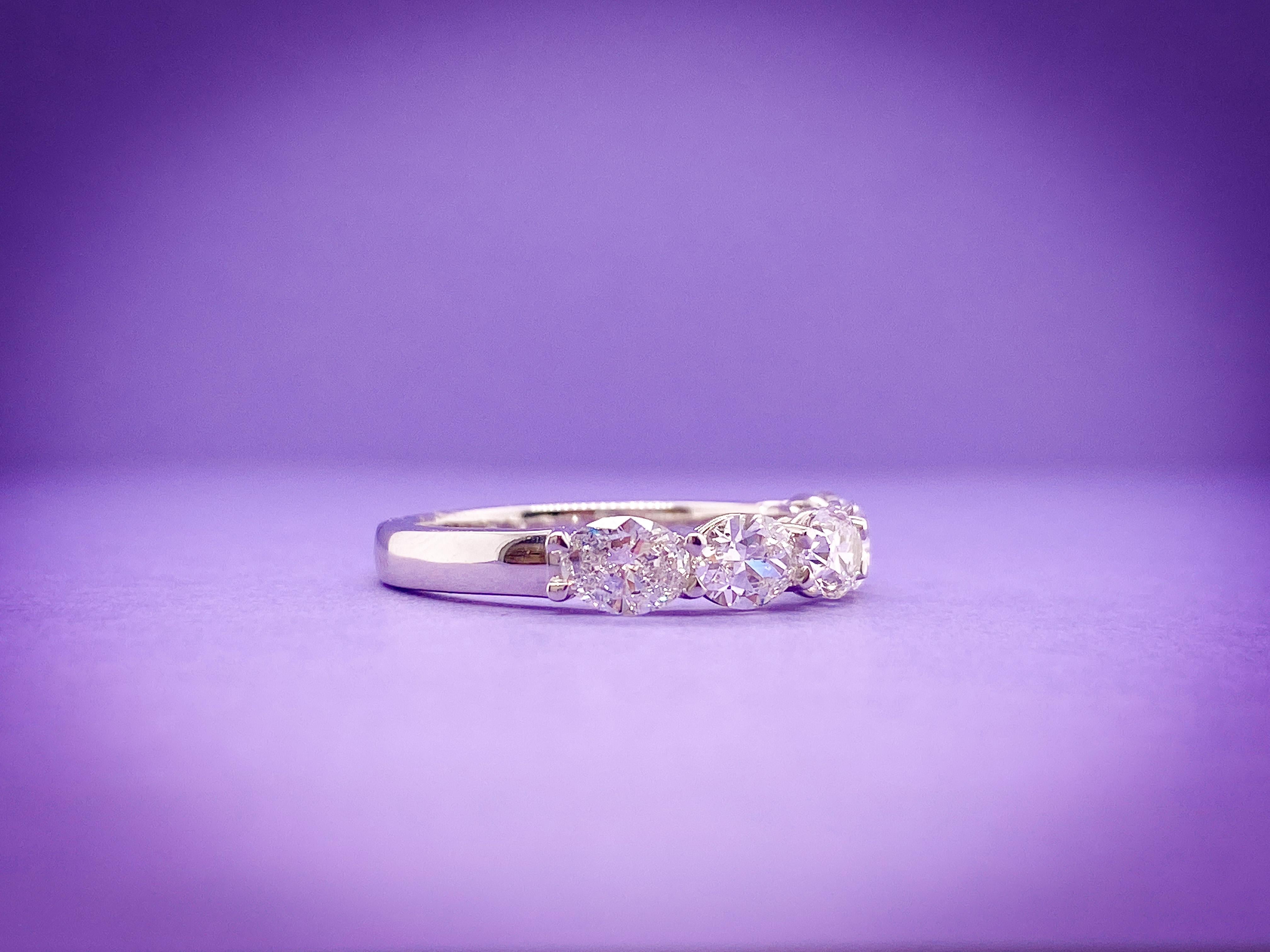 This 5 Stone Oval Partway Band sparkles and shimmers. The stones weighing 1.45 Total Carat Weight are F-G Color and SI Clarity, set in Platinum. The stones are set Horizontal for an added unique twist. 