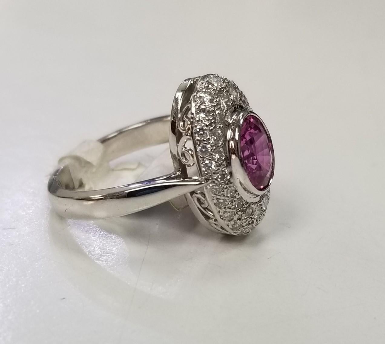 Specifications: 
    Metal: Platinum
    Weight: 7.8 Gr
    Main Stone: Pink Sapphire 1.42cts.
    Side Stones: 40 Diamonds    
    Weight: .65pts.
    Color: G
    Clarity: VS
    Size: 6.25 US






