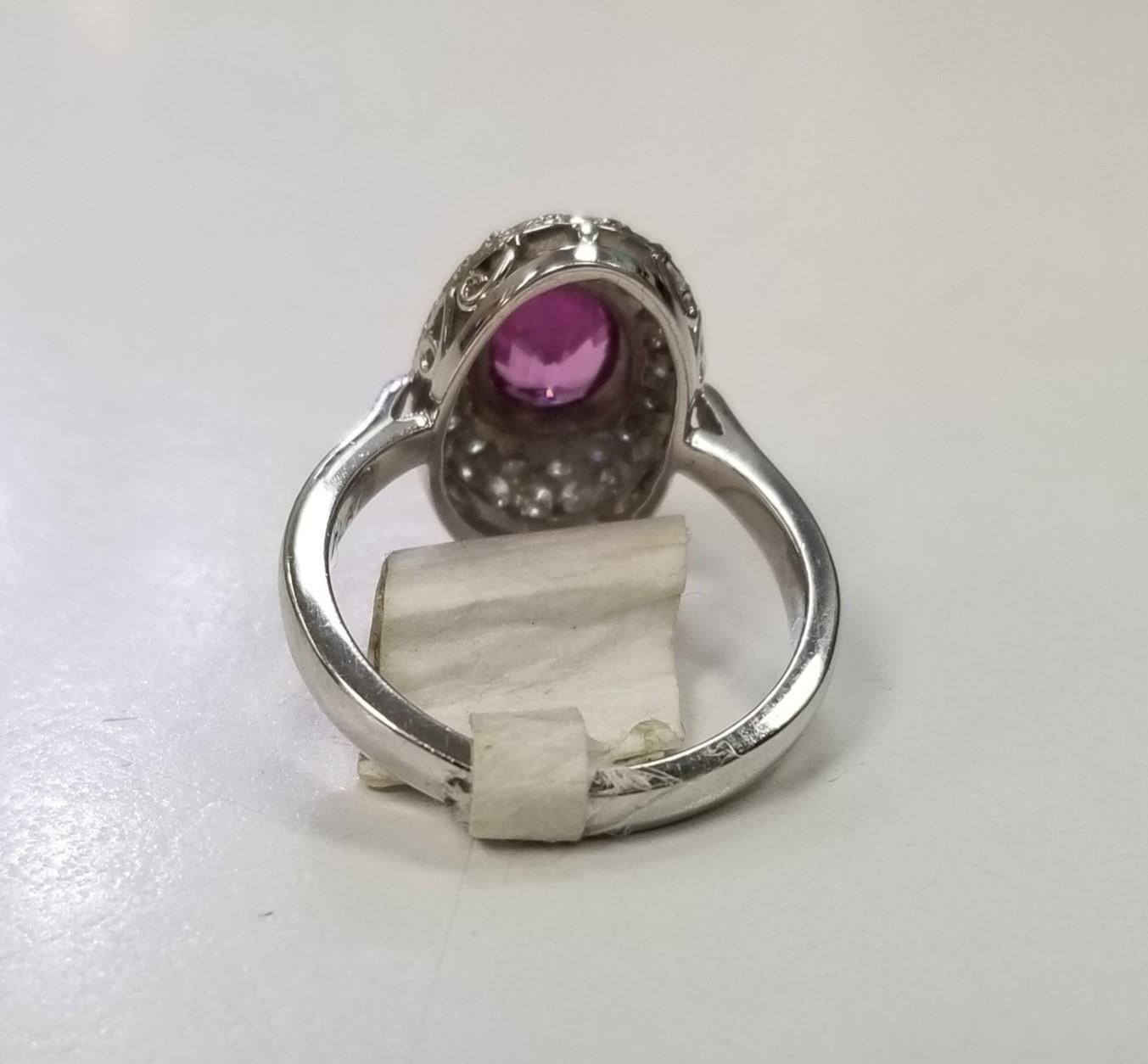 Contemporary Platinum Oval Pink Sapphire and Diamond Pave' Ring For Sale